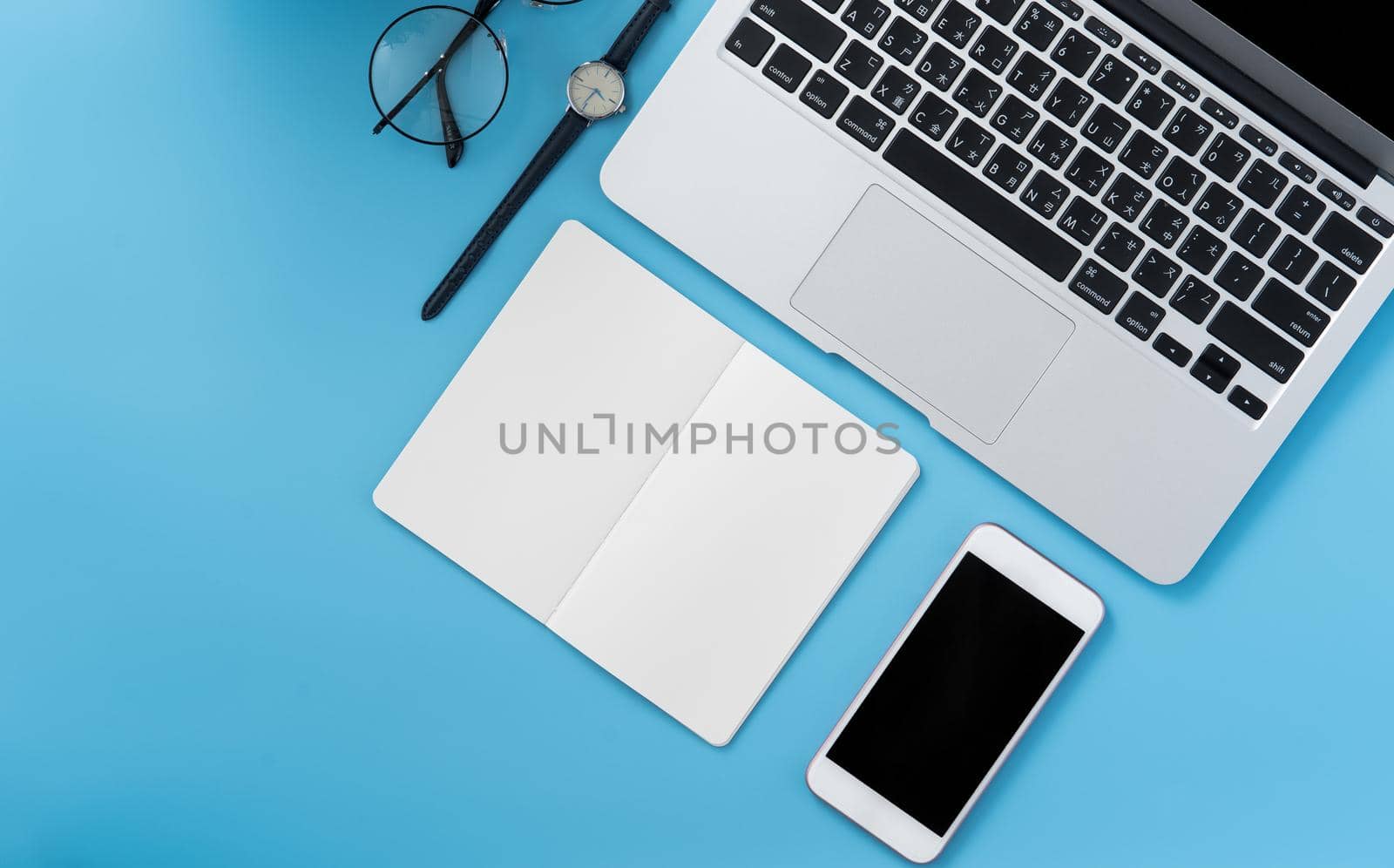 Concept of stylized home office table with fashion accessories, minimal interior, workspace design, close up, flat lay, copy space, top view, mockup