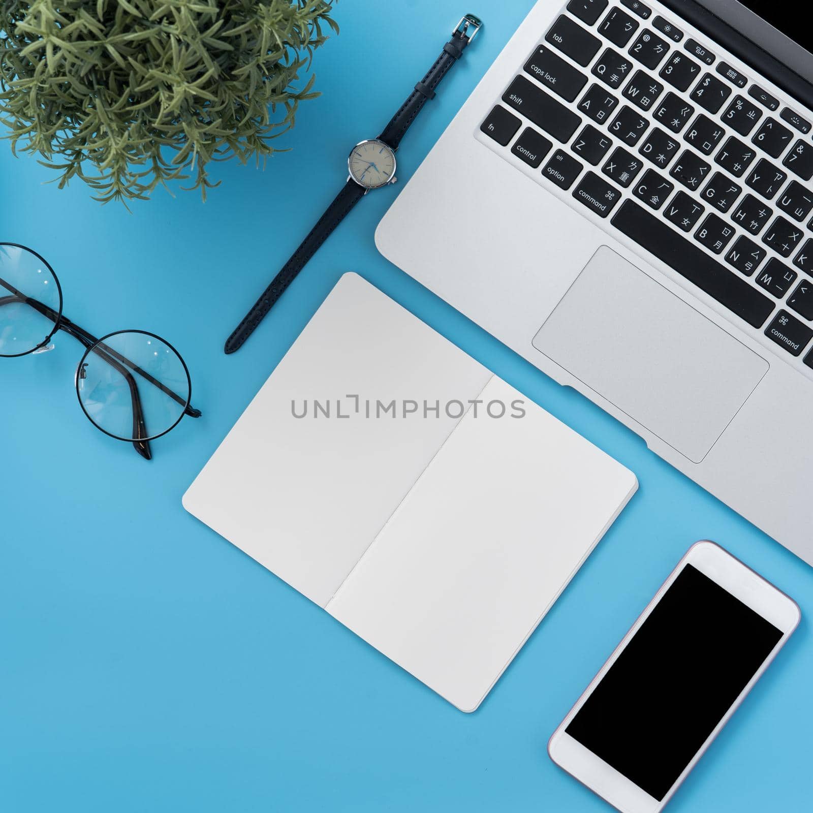 Concept of stylized home office table with fashion accessories, minimal interior, workspace design, close up, flat lay, copy space, top view, mockup