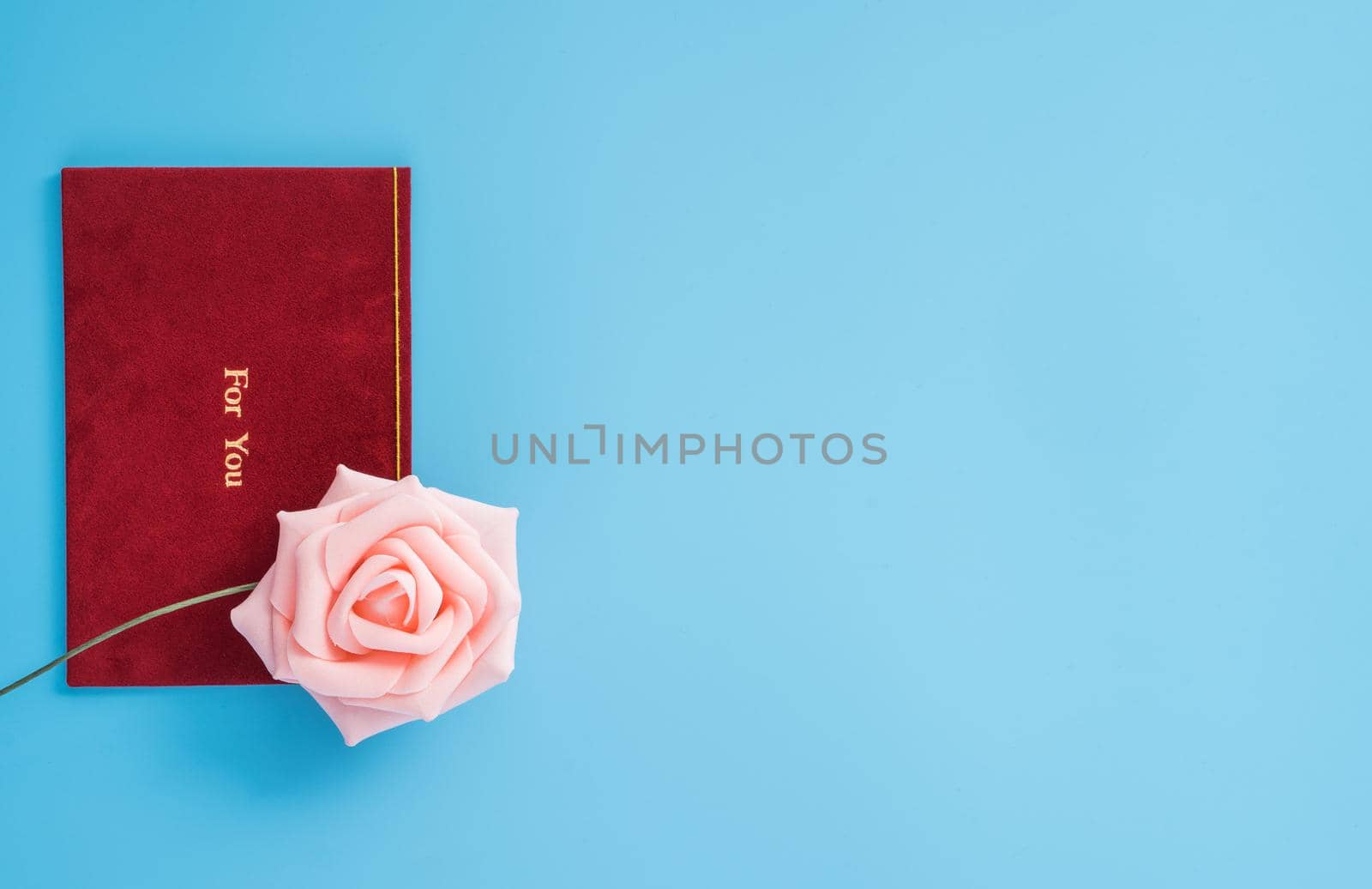 Concept of beautiful Valentine's day, anniversary, mother's day and birthday present and greetings on blue background, copyspace, topview, mockup