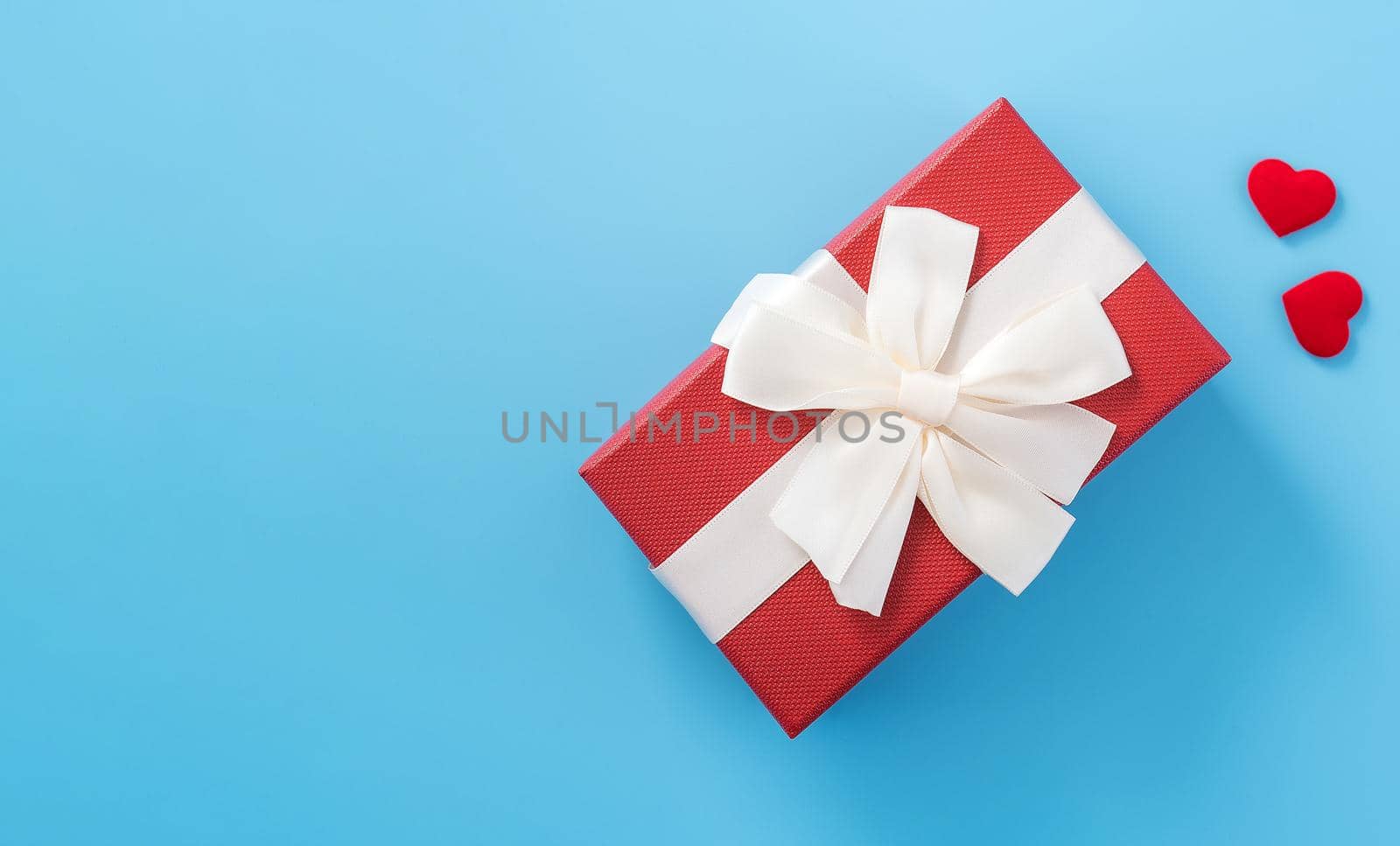 Concept of beautiful Valentine's day, anniversary, mother's day and birthday present and greetings on blue background, copyspace, topview, mockup