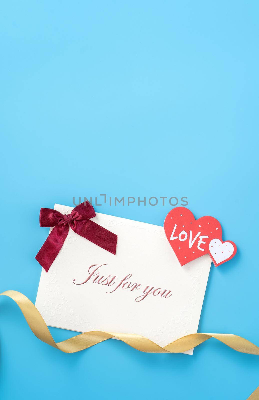 Concept of beautiful Valentine's day, anniversary, mother's day and birthday present and greetings on blue background, copyspace, topview, mockup