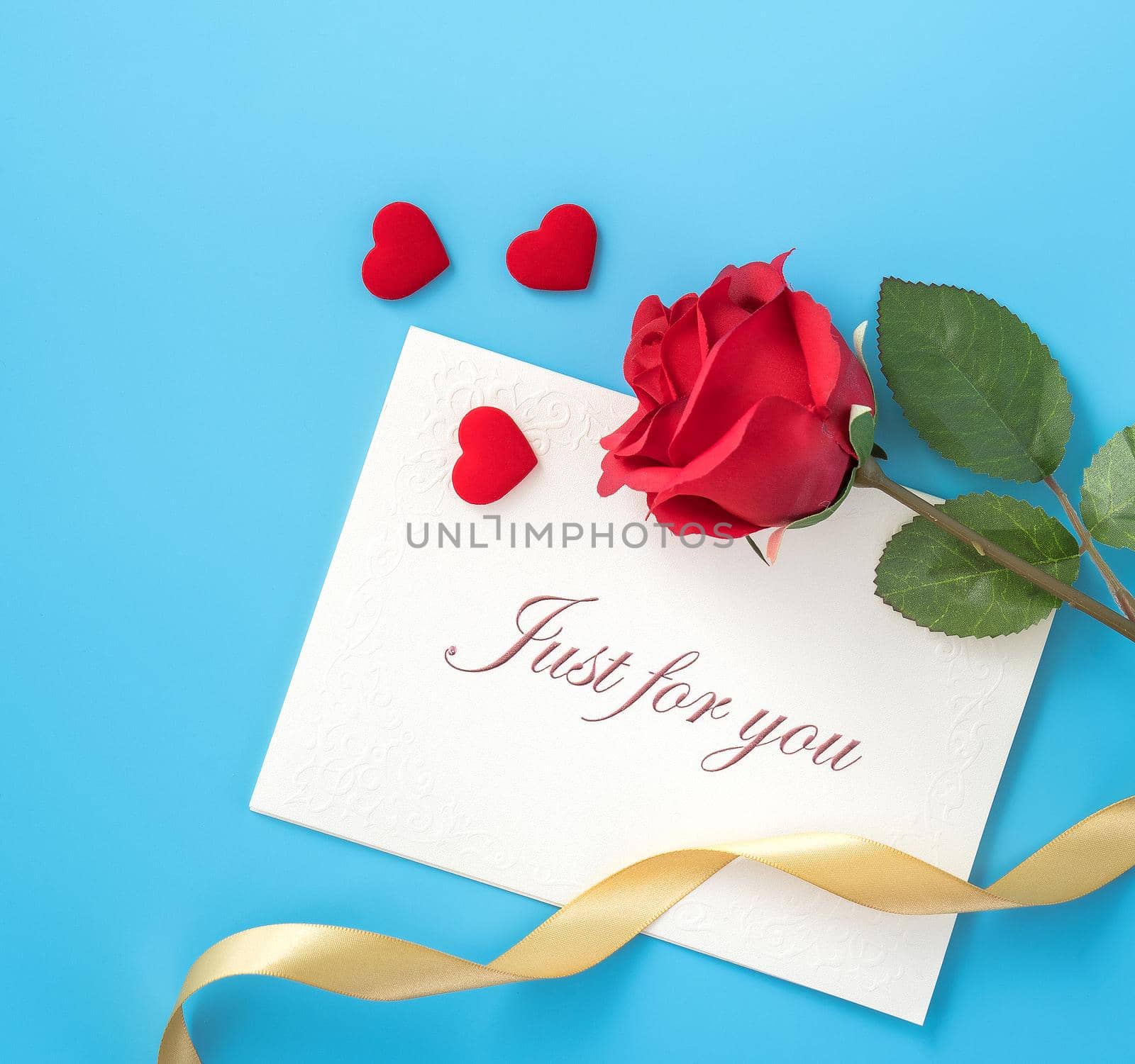 Concept of beautiful Valentine's day, anniversary, mother's day and birthday present and greetings on blue background, copyspace, topview, mockup