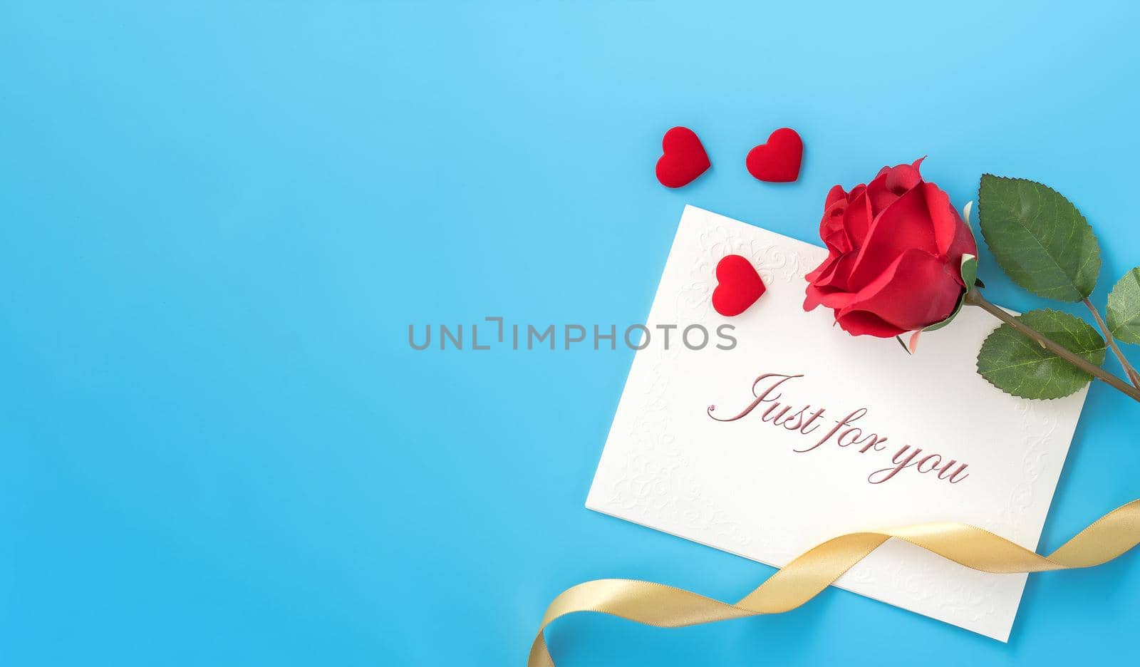 Concept of beautiful Valentine's day, anniversary, mother's day and birthday present and greetings on blue background, copyspace, topview, mockup