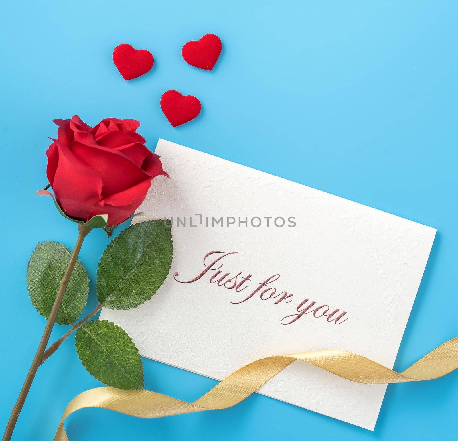 Concept of beautiful Valentine's day, anniversary, mother's day and birthday present and greetings on blue background, copyspace, topview, mockup
