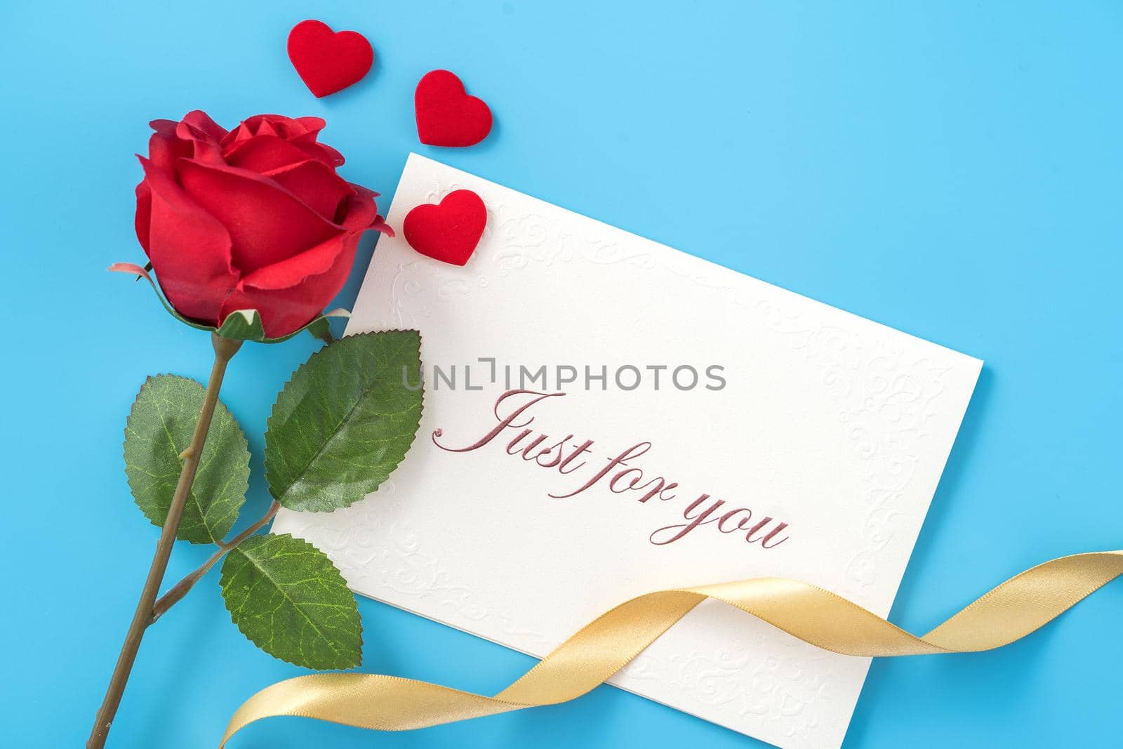 Concept of beautiful Valentine's day, anniversary, mother's day and birthday present and greetings on blue background, copyspace, topview, mockup
