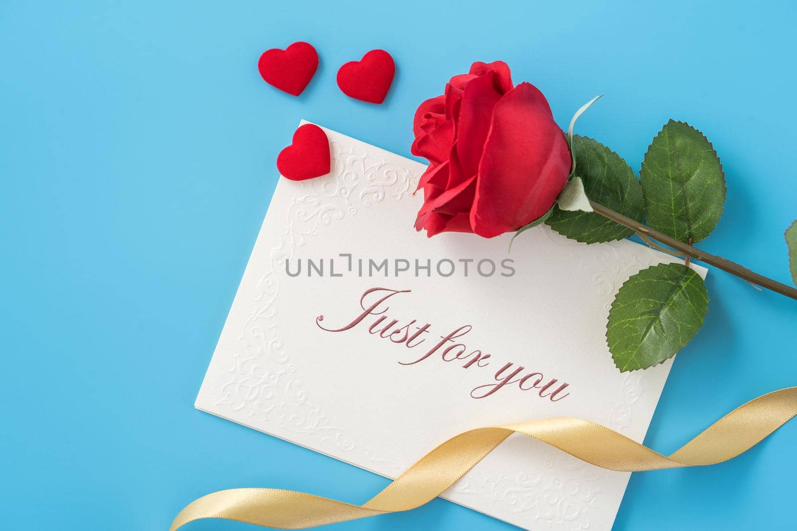 Concept of beautiful Valentine's day, anniversary, mother's day and birthday present and greetings on blue background, copyspace, topview, mockup