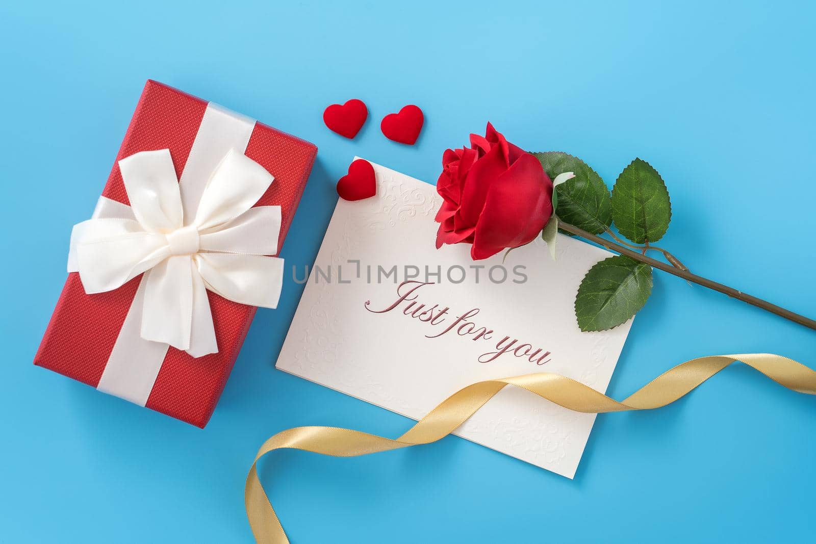 Concept of beautiful Valentine's day, anniversary, mother's day and birthday present and greetings on blue background, copyspace, topview, mockup