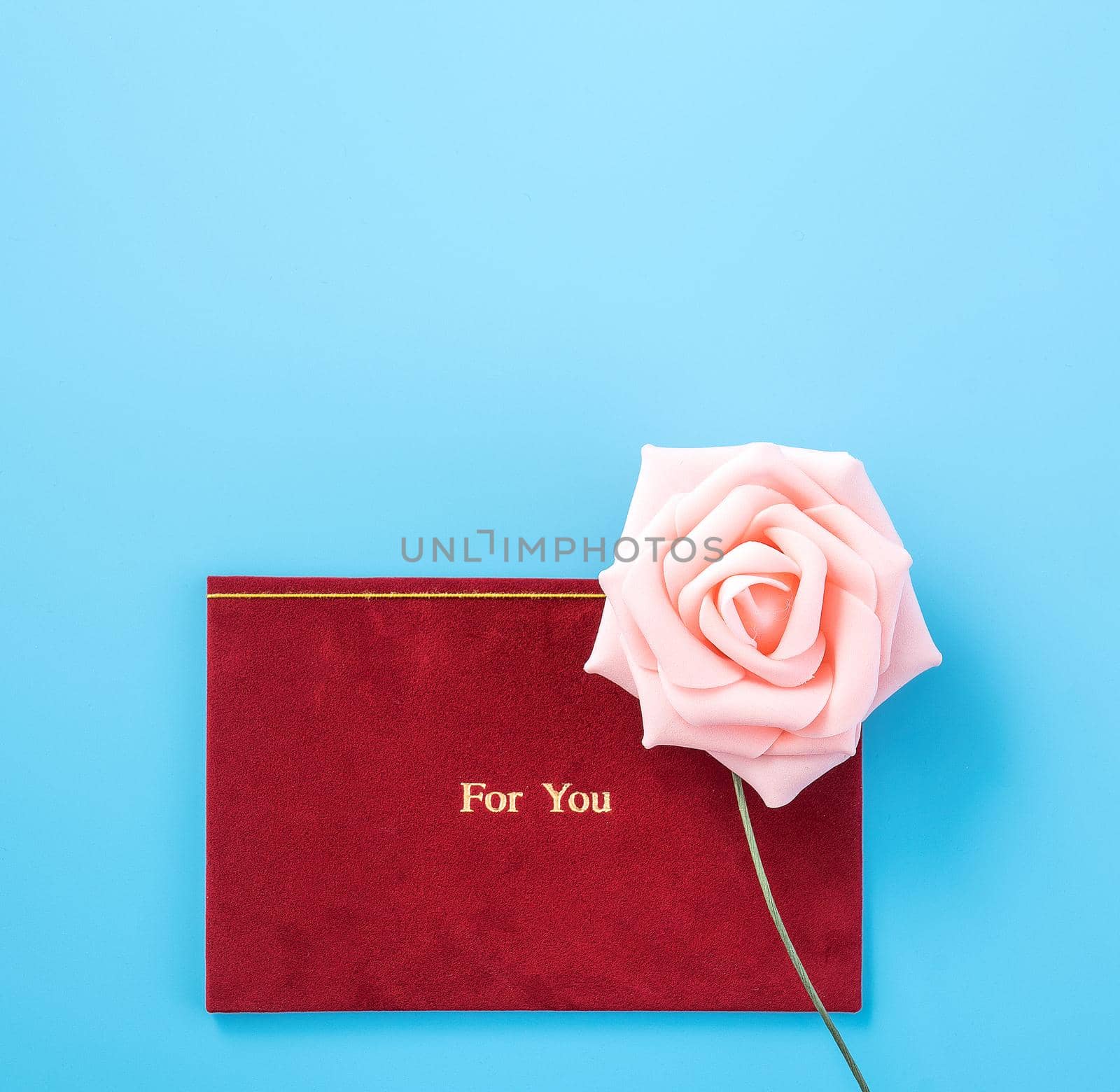 Concept of beautiful Valentine's day, anniversary, mother's day and birthday present and greetings on blue background, copyspace, topview, mockup