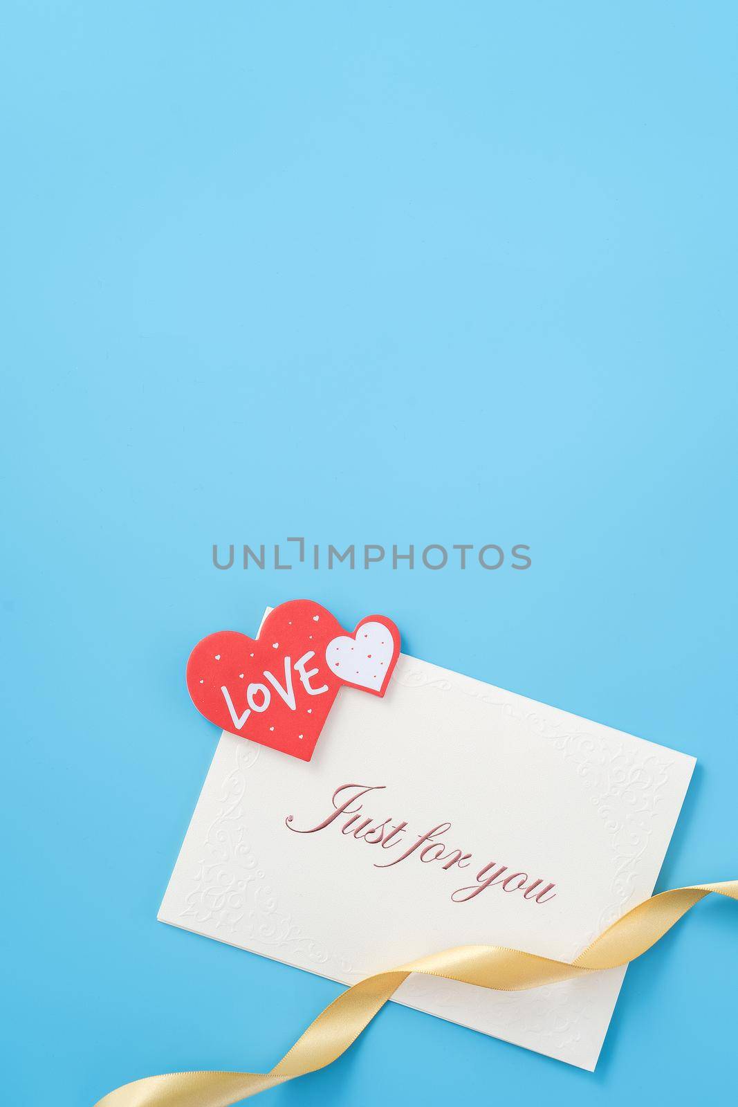 Concept of beautiful Valentine's day, anniversary, mother's day and birthday present and greetings on blue background, copyspace, topview, mockup