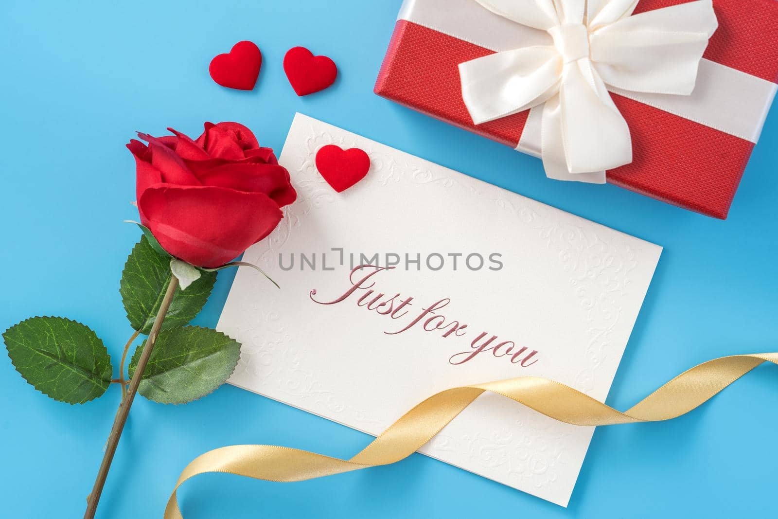 Concept of beautiful Valentine's day, anniversary, mother's day and birthday present and greetings on blue background, copyspace, topview, mockup