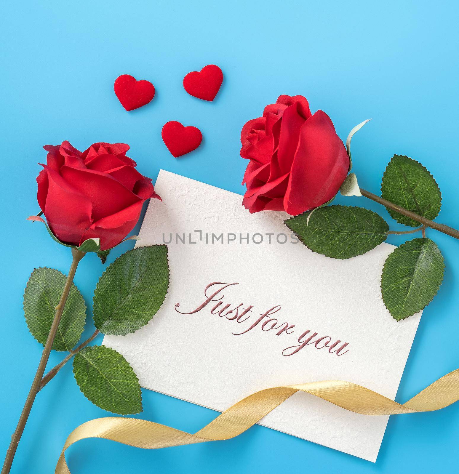 Concept of beautiful Valentine's day, anniversary, mother's day and birthday present and greetings on blue background, copyspace, topview, mockup