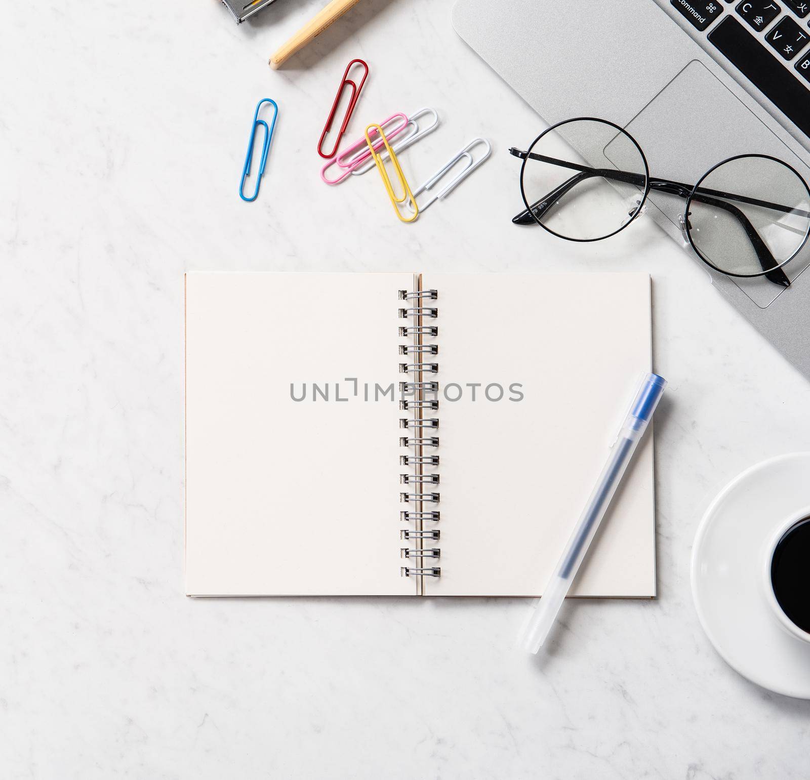 Stylized marble office working desk with smartphone, laptop, glasses and coffee, workspace design, mock up, topview, flatlay, copyspace, closeup by ROMIXIMAGE