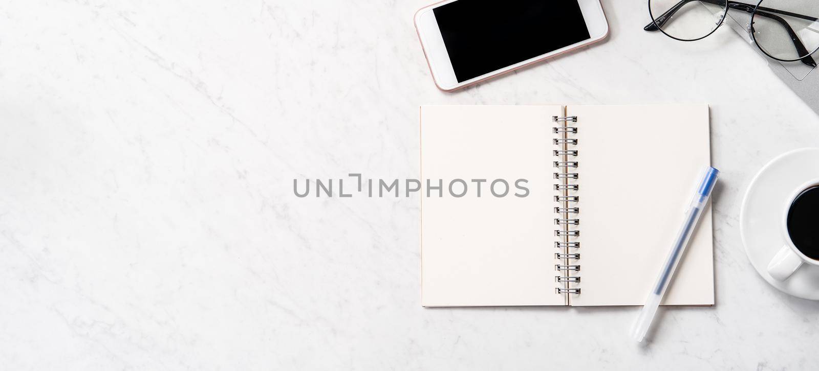 Stylized marble office working desk with smartphone, laptop, glasses and coffee, workspace design, mock up, topview, flatlay, copyspace, closeup by ROMIXIMAGE