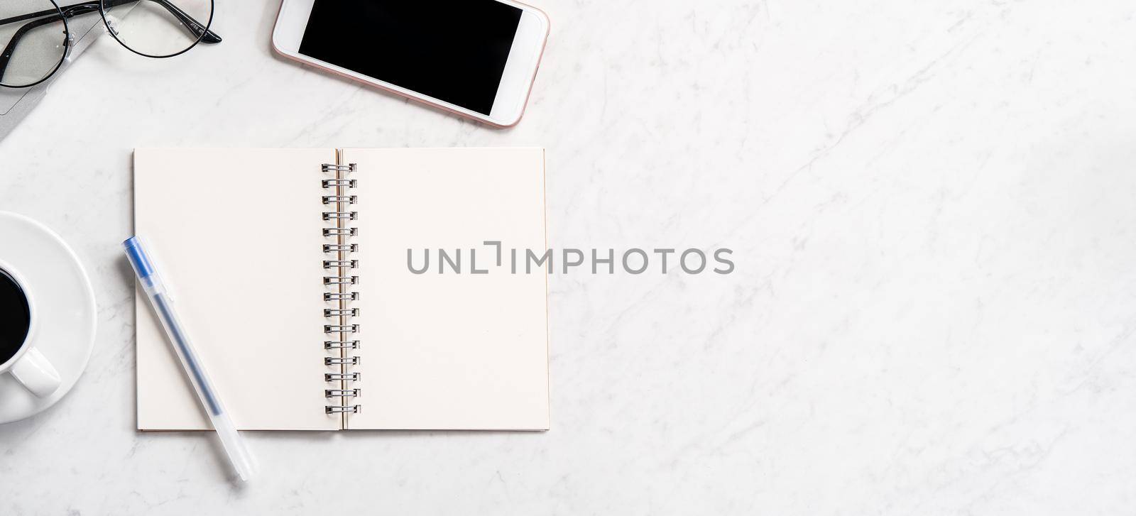 Stylized marble office working desk with smartphone, laptop, glasses and coffee, workspace design, mock up, topview, flatlay, copyspace, closeup by ROMIXIMAGE