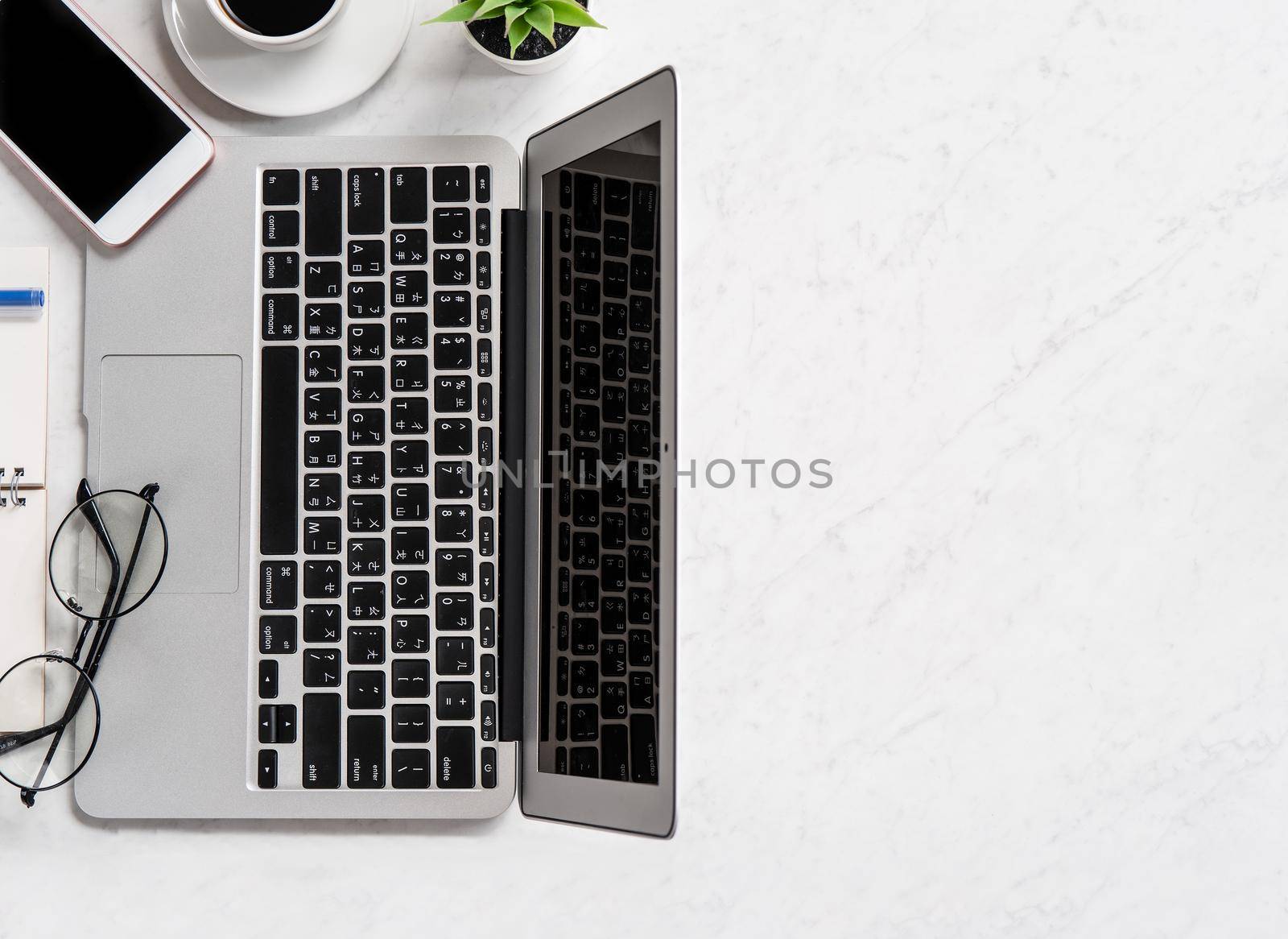 Stylized marble office working desk with smartphone, laptop, glasses and coffee, workspace design, mock up, topview, flatlay, copyspace, closeup by ROMIXIMAGE