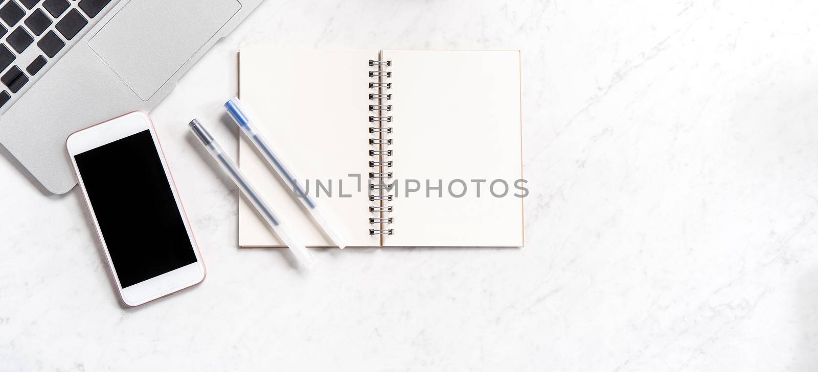 Stylized marble office working desk with smartphone, laptop, glasses and coffee, workspace design, mock up, topview, flatlay, copyspace, closeup by ROMIXIMAGE