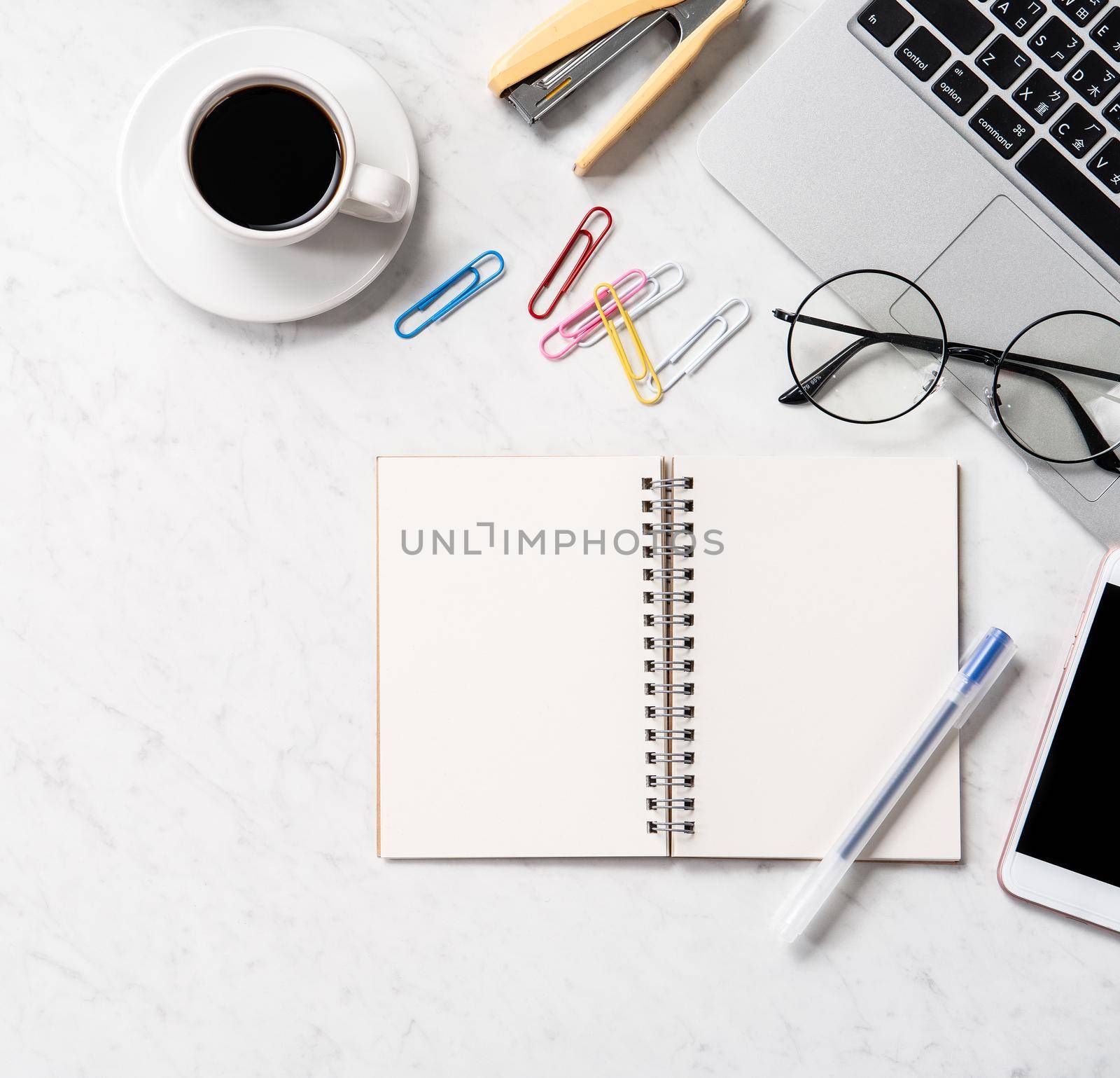 Stylized marble office working desk with smartphone, laptop, glasses and coffee, workspace design, mock up, topview, flatlay, copyspace, closeup by ROMIXIMAGE