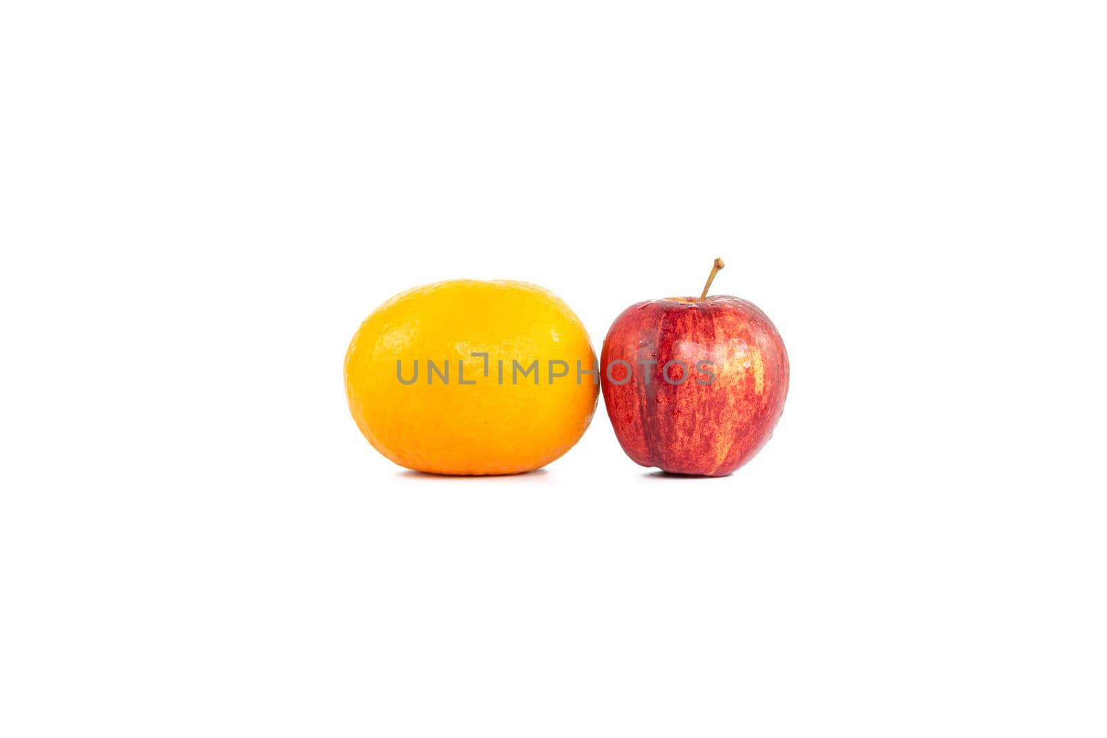 Oranges or tangerine and apple isolated on white background