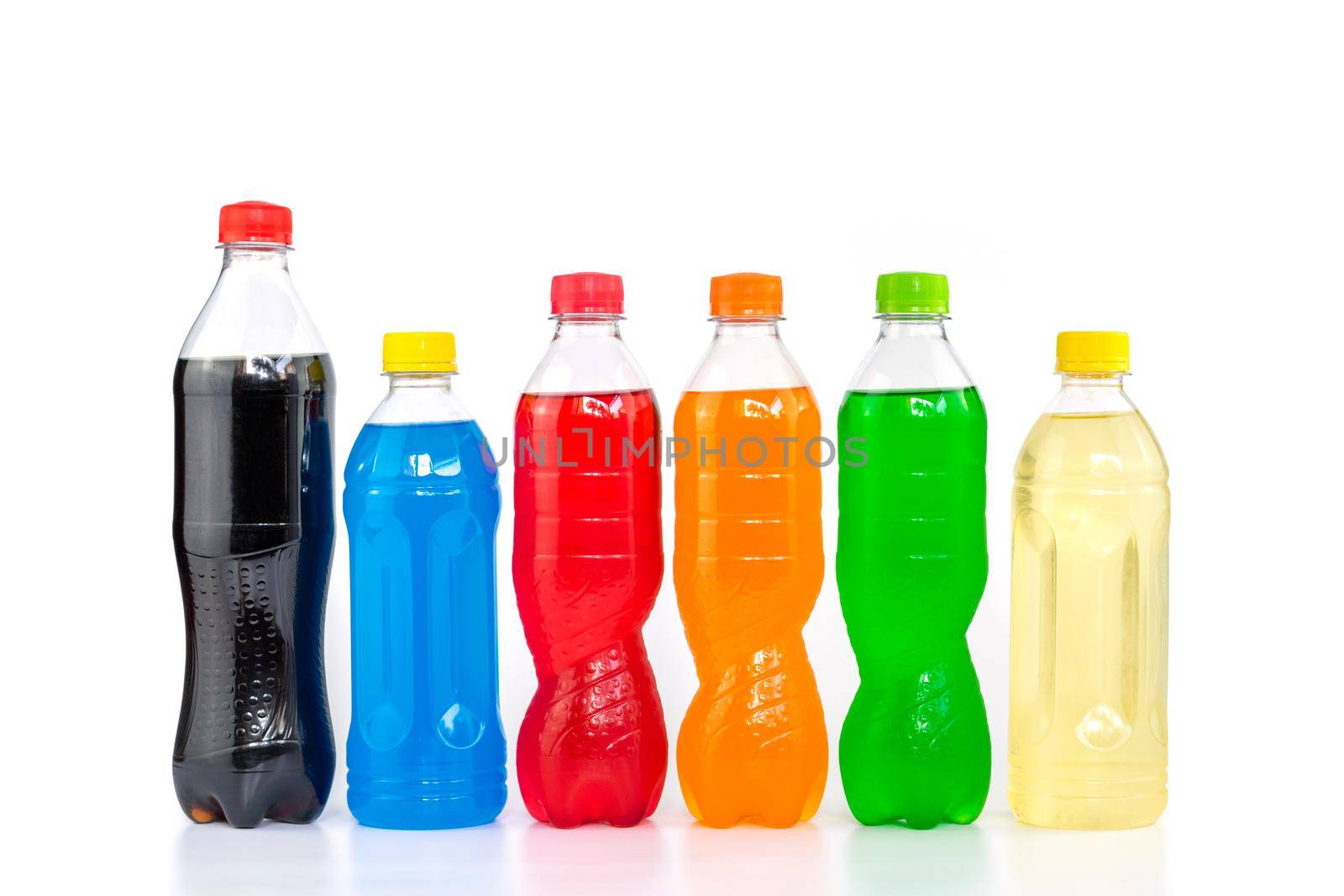 Multi colored drinks in plastic bottles isolated on white background.