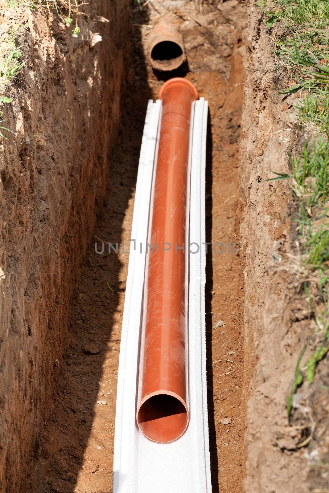 Installation of water main, sanitary sewer, storm drain systems, plastic pipes wrapped in insulation