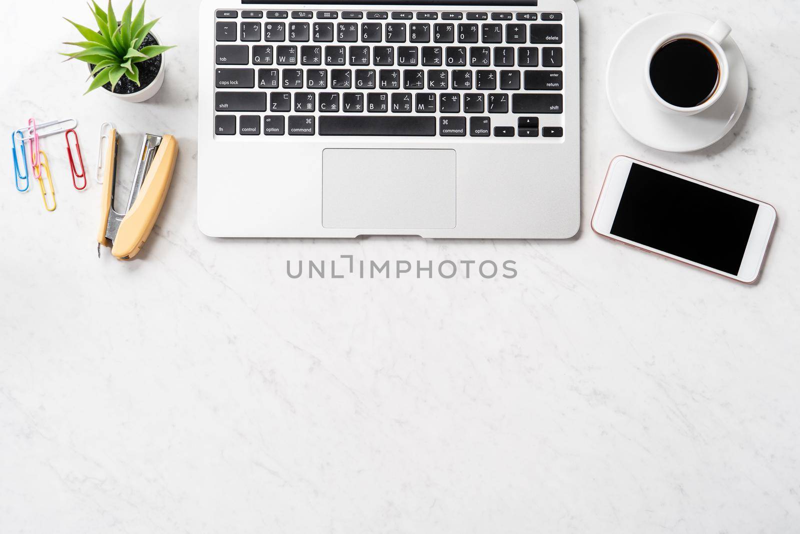 Stylized marble office working desk with smartphone, laptop, glasses and coffee, workspace design, mock up, topview, flatlay, copyspace, closeup by ROMIXIMAGE