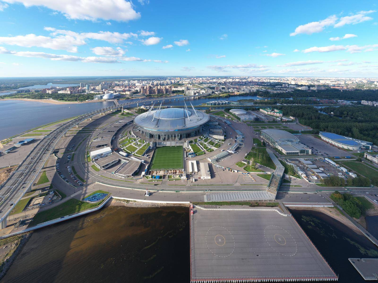 Russia, St.Petersburg, 01 September 2020: Drone point of view of new stadium Gazprom Arena, Euro 2020, retractable soccer field, skyscraper Lakhta center on background, clear weather, helipad by vladimirdrozdin