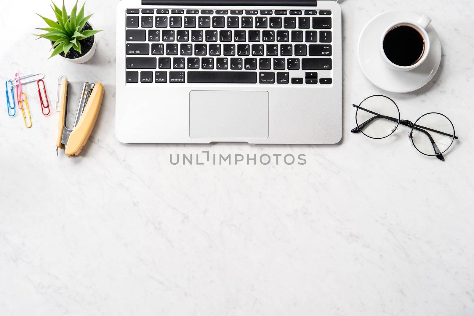 Stylized marble office working desk with smartphone, laptop, glasses and coffee, workspace design, mock up, topview, flatlay, copyspace, closeup by ROMIXIMAGE