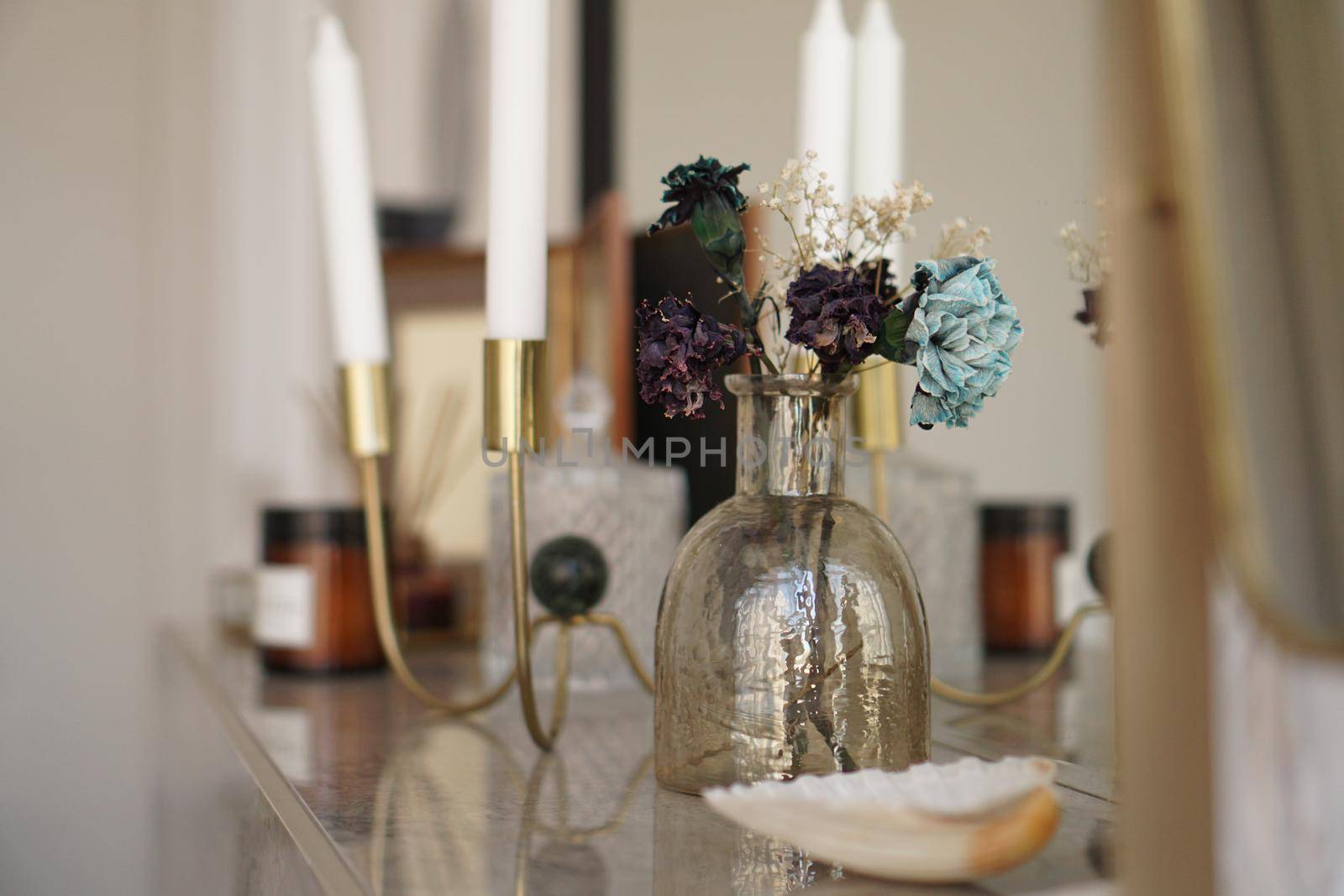 Home interior decor. Glass jar with dried flowers, vase and candle by natali_brill