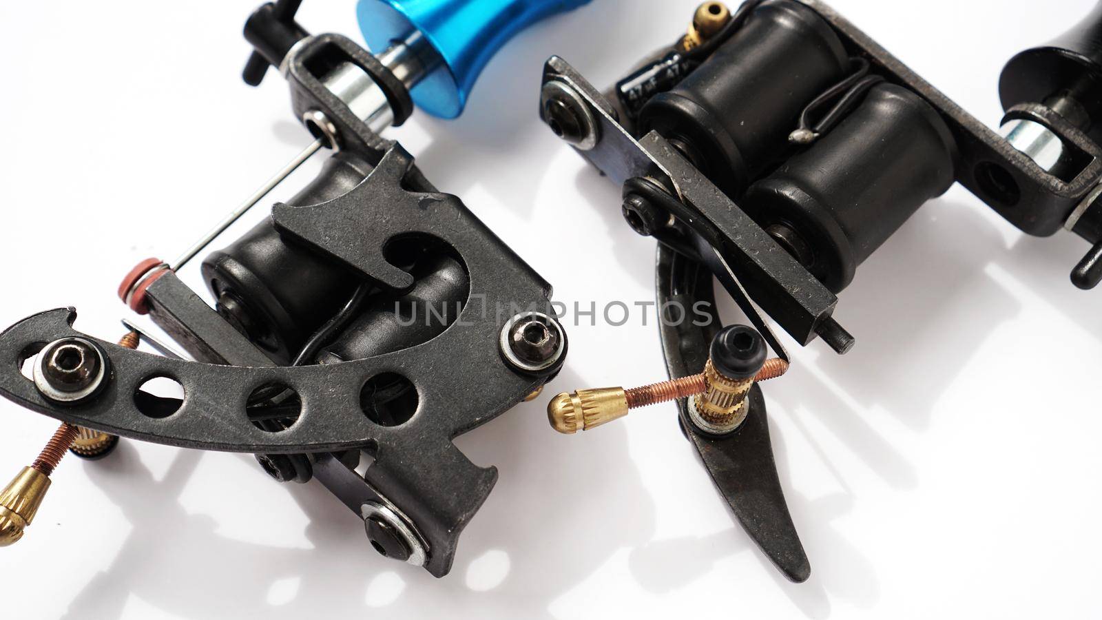 Two tattoo machines on a white background - tattoo industry