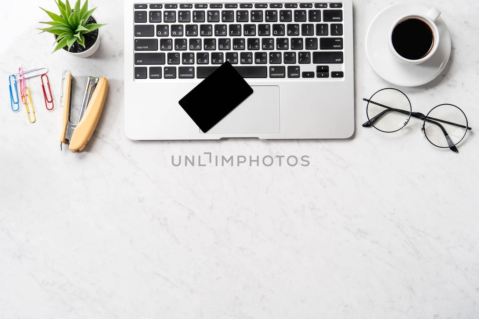 Online payment concept, mock up credit card with office desk computer isolated on beautiful marble background, workspace design, topview, flatlay, copyspace. by ROMIXIMAGE