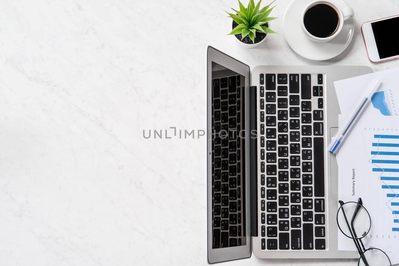 A woman is doing a online payment or shopping, mock up credit card and mobile phone on office desk isolated on beautiful fashion marble background, topview, flatlay, copyspace.