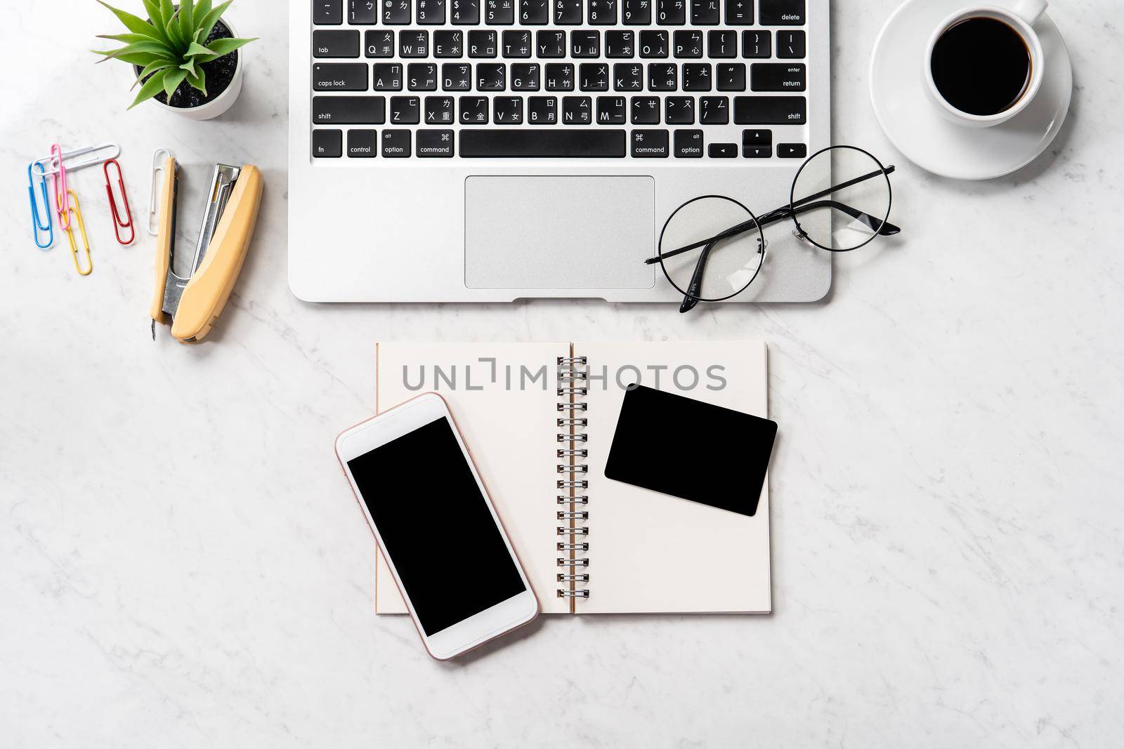 Online purchase concept, mock up credit card with fashion office desk computer isolated on beautiful marble background, workspace design, topview, flatlay, copyspace, closeup