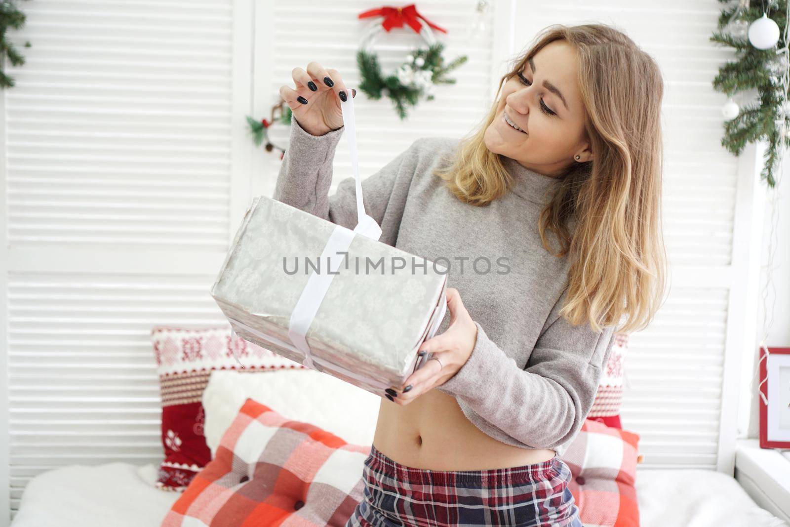 The cheerful woman got a surprise gift box at New Year morning
