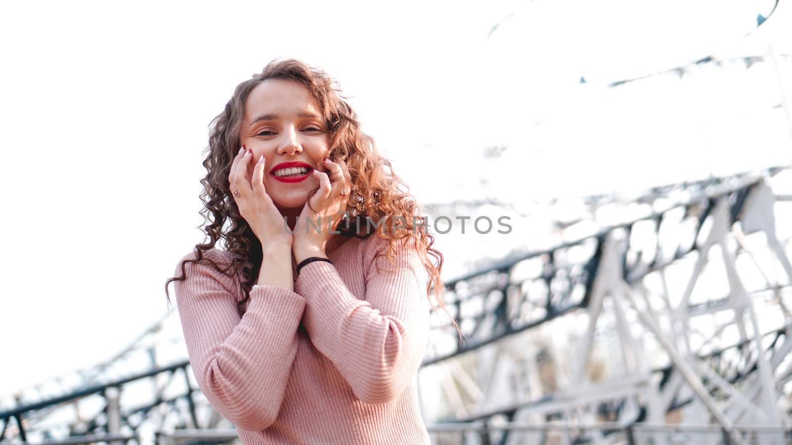 Beautiful smiling girl on a background of a roller coaster by natali_brill