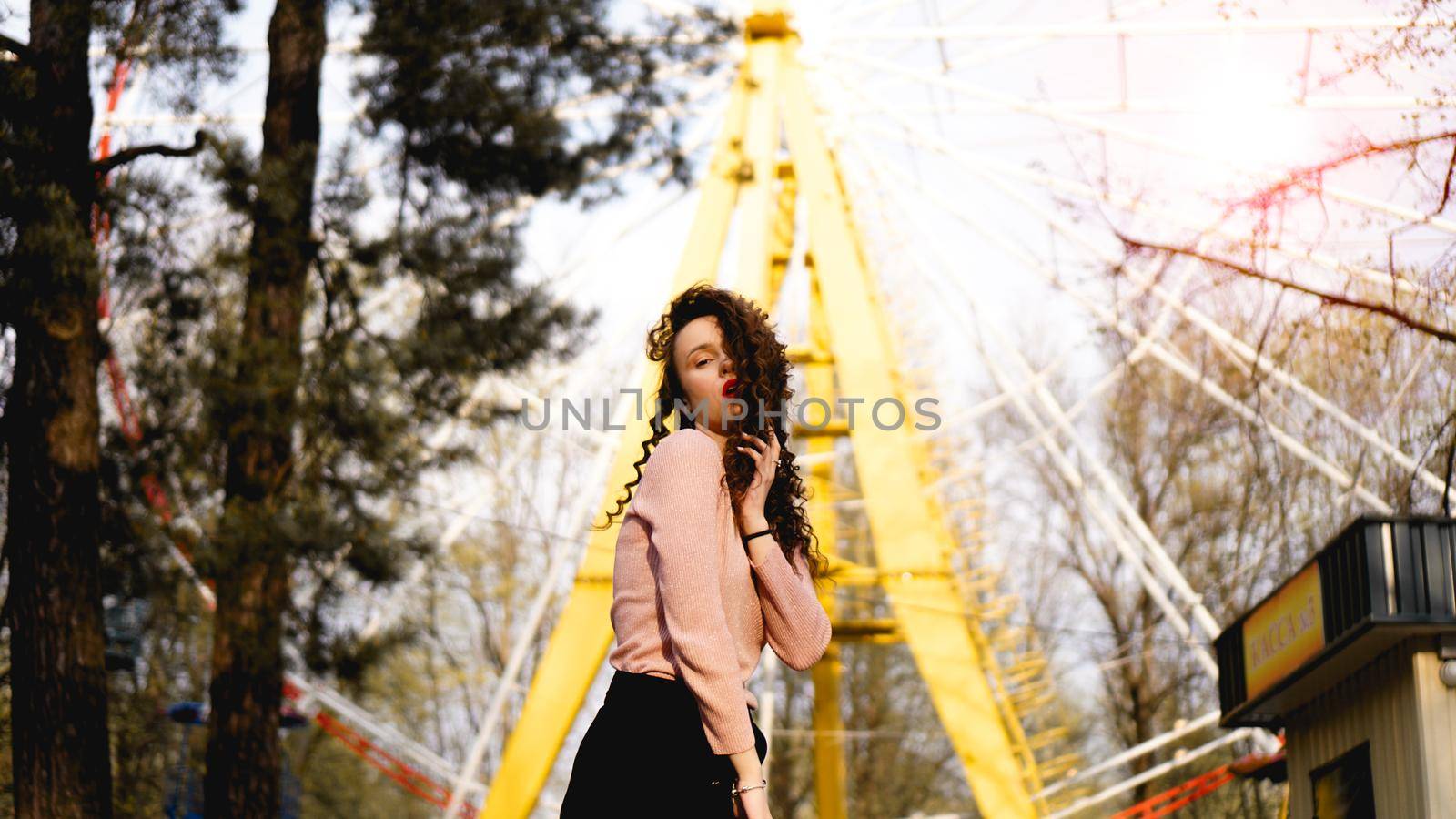 Beautiful exited smiling woman having fun at amusement park at hot summer day by natali_brill