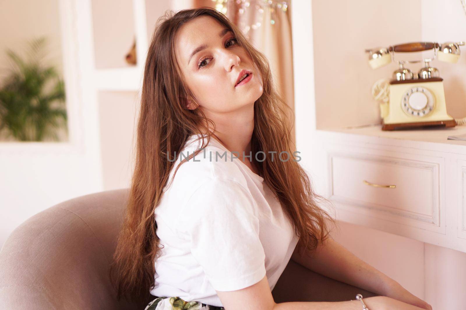 Beautiful happy woman in her room near her dressing table posing before party by natali_brill