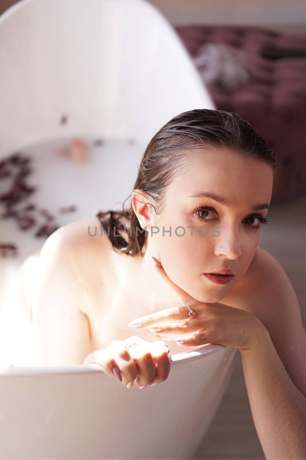 Young attractive woman relaxing in bath by natali_brill