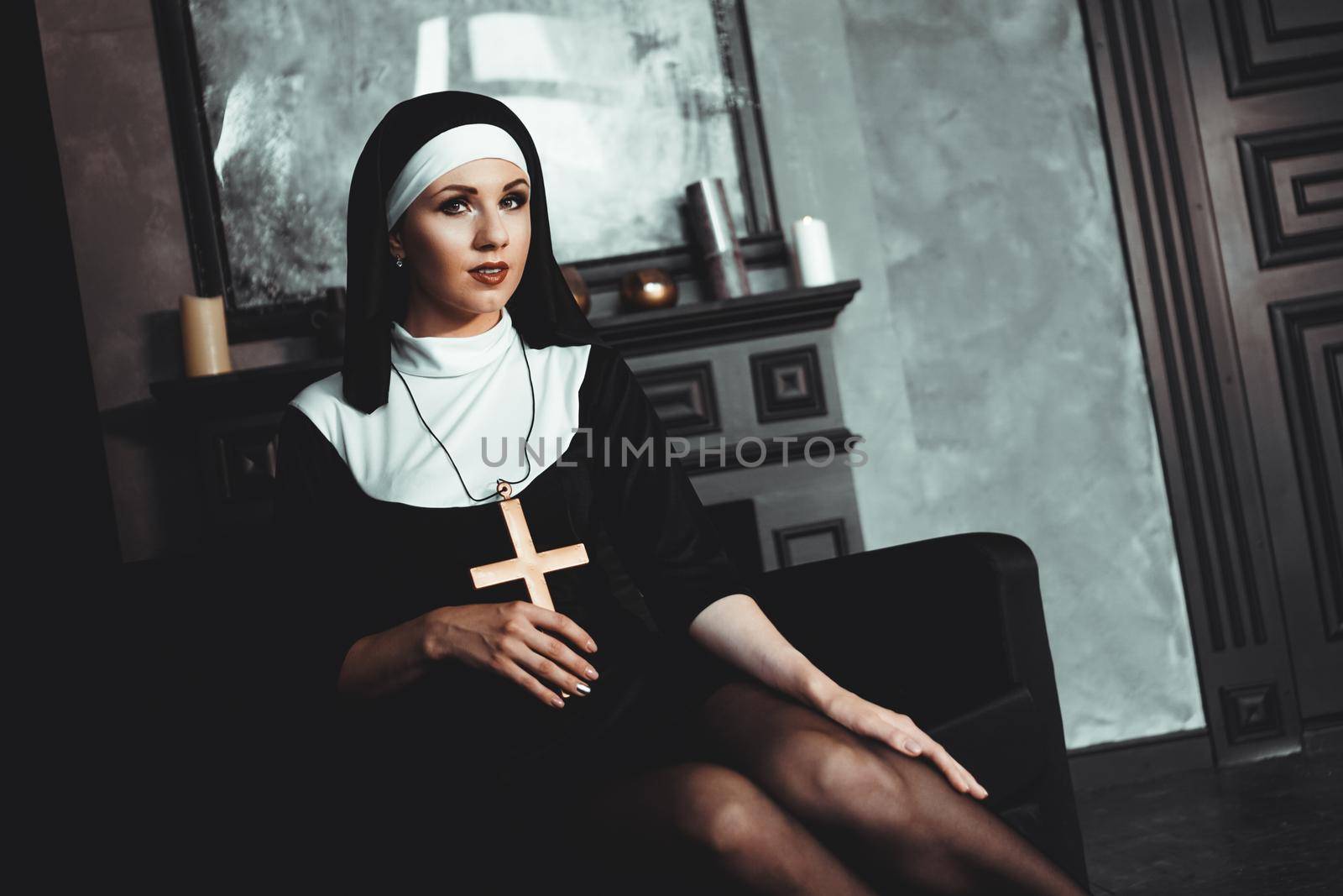 Sexy nun prays indoor. Beautiful young holy sister. by natali_brill