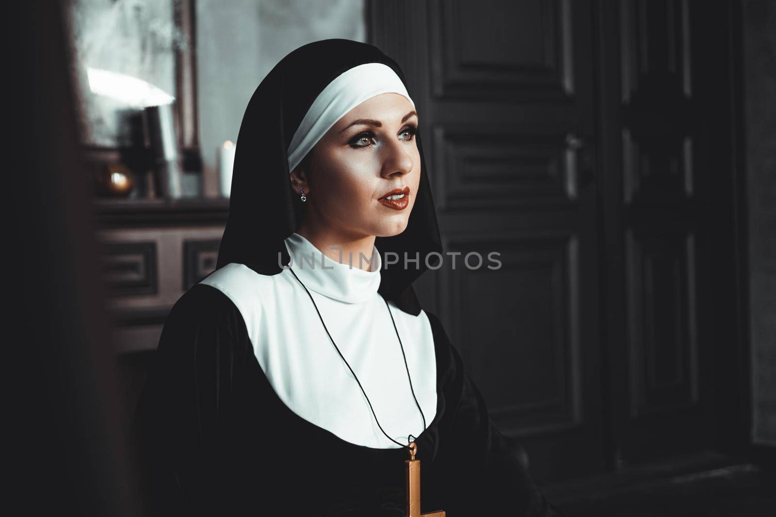 Sexy nun prays indoor. Beautiful young holy sister. by natali_brill