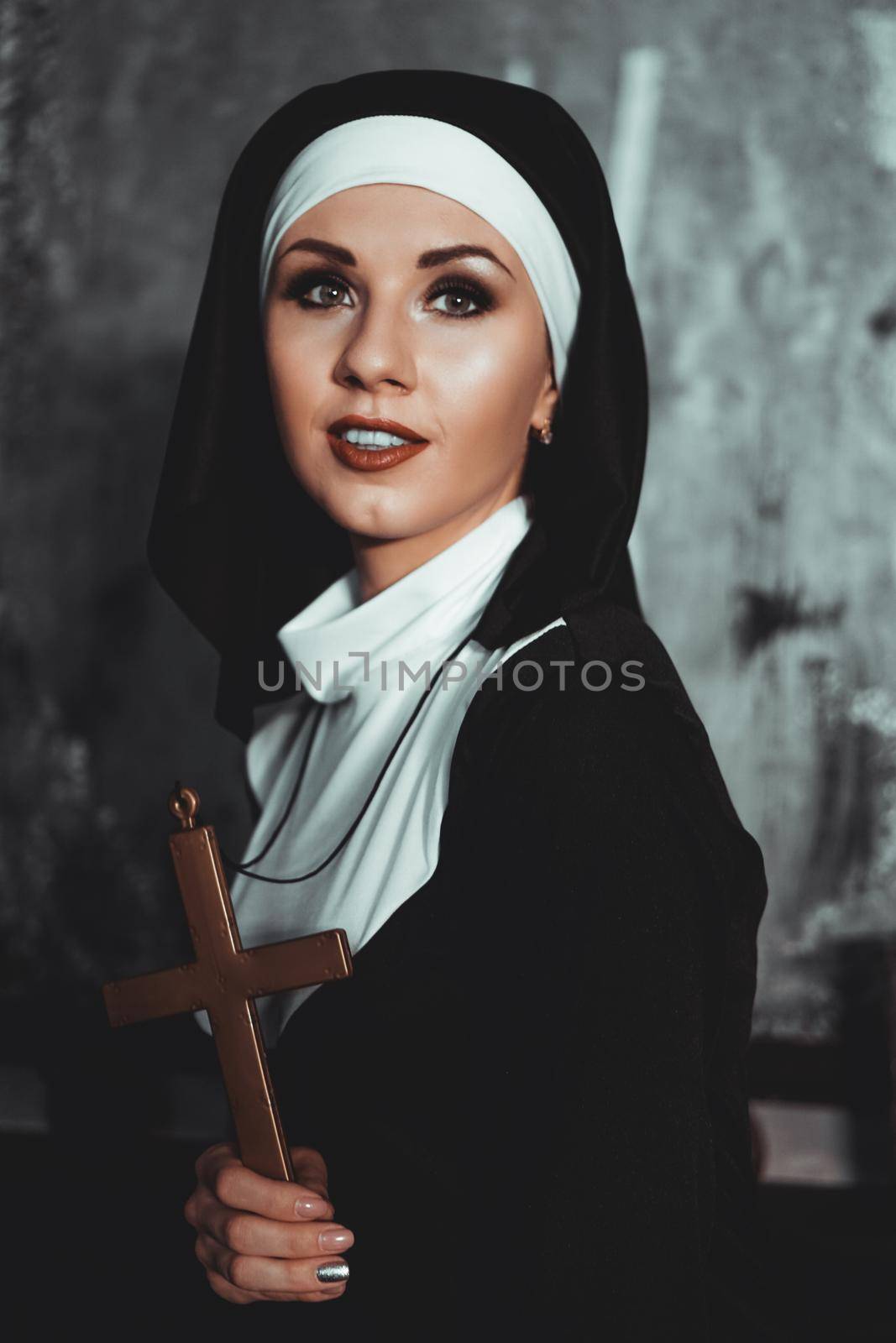 Sexy nun prays indoor. Beautiful young holy sister. by natali_brill