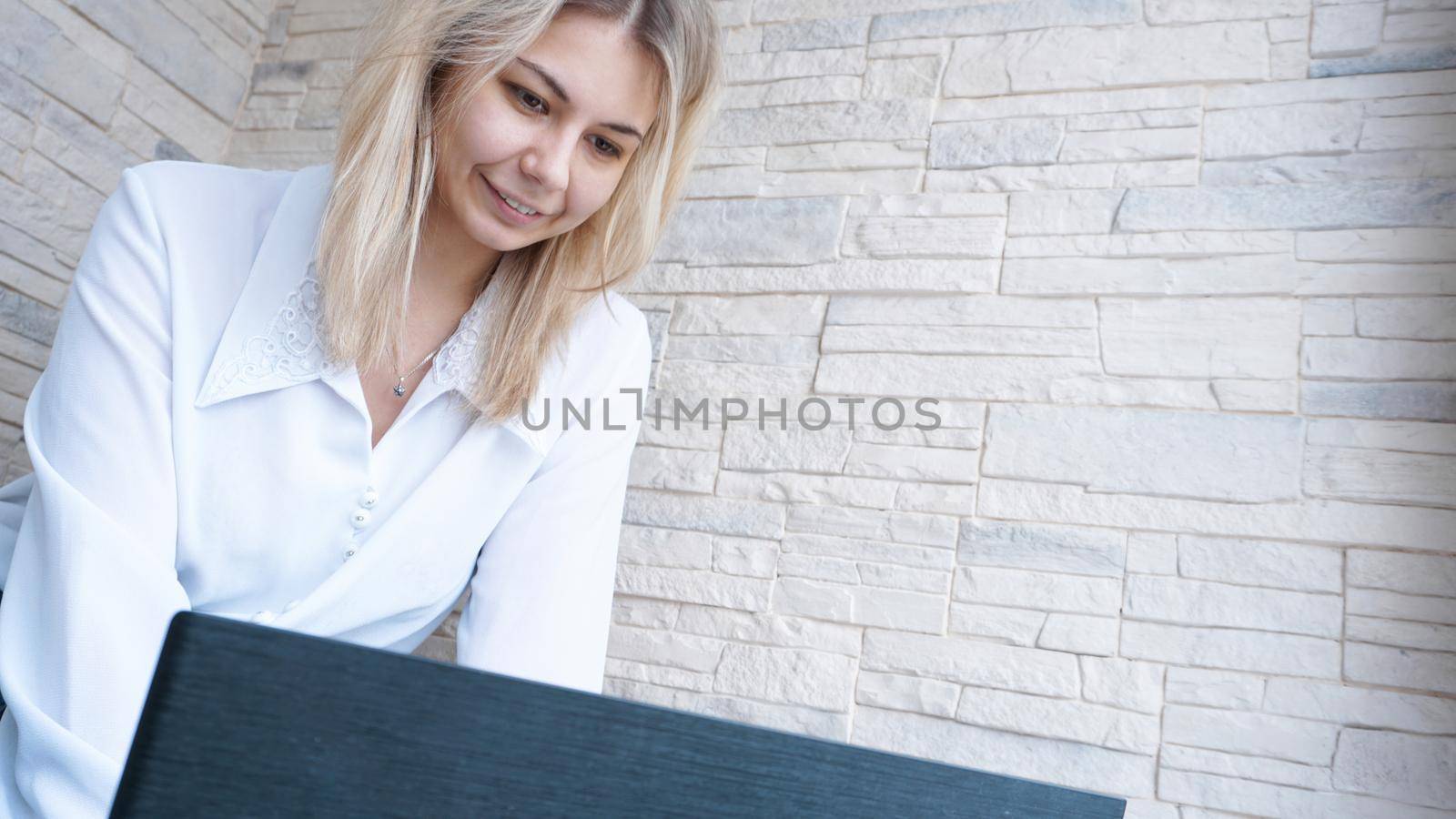 Side view. Young business woman with notebook by natali_brill