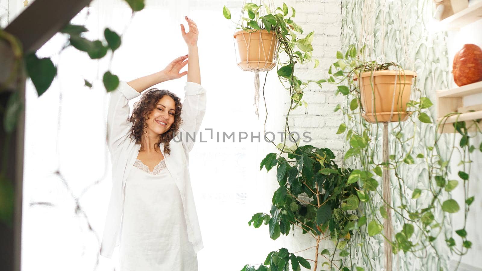 Beautiful woman after waking up in the morning. Sleepy female with satisfied facial expression. Healthy and happiness concept