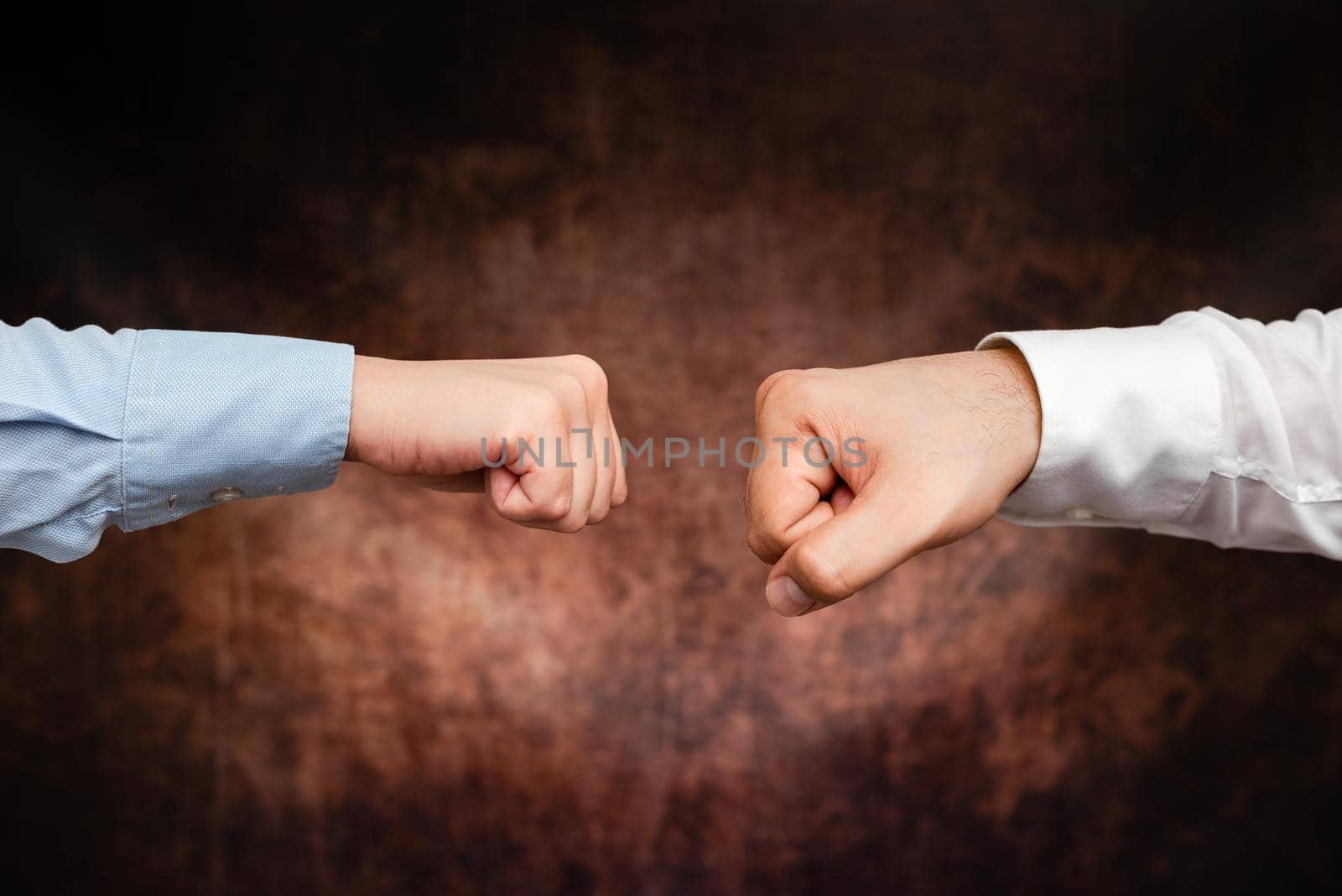 Corporate Businessmen Handshake Indoors.Two People Professionally Well Dressed Gesturing Togetherness.Working Colleague Partners Sign Deal In Agreement To Contract by nialowwa