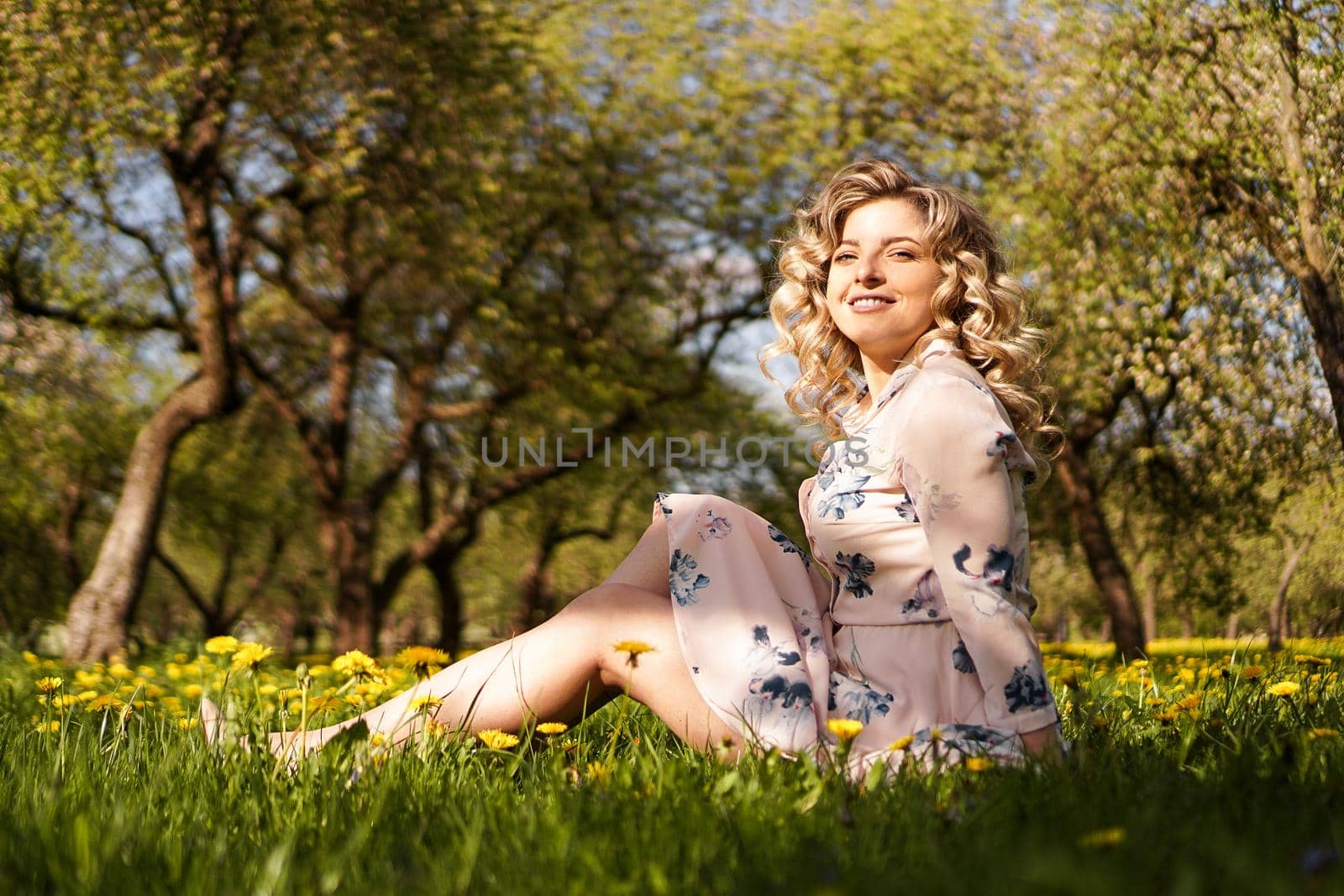 Cute woman rest in the park with dandelions by natali_brill