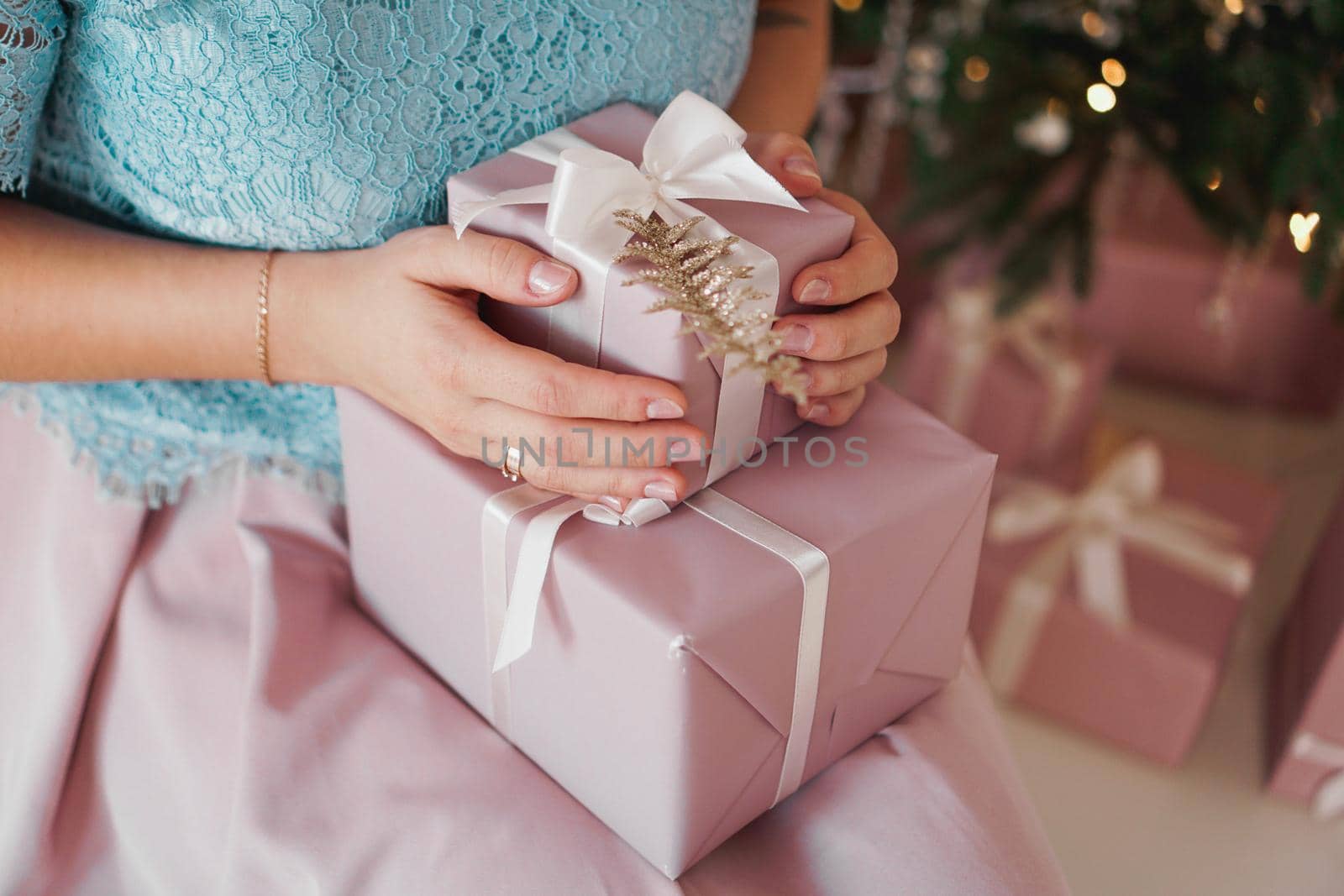 Hands holding gift present. Closeup of Female hands giving the gift by natali_brill