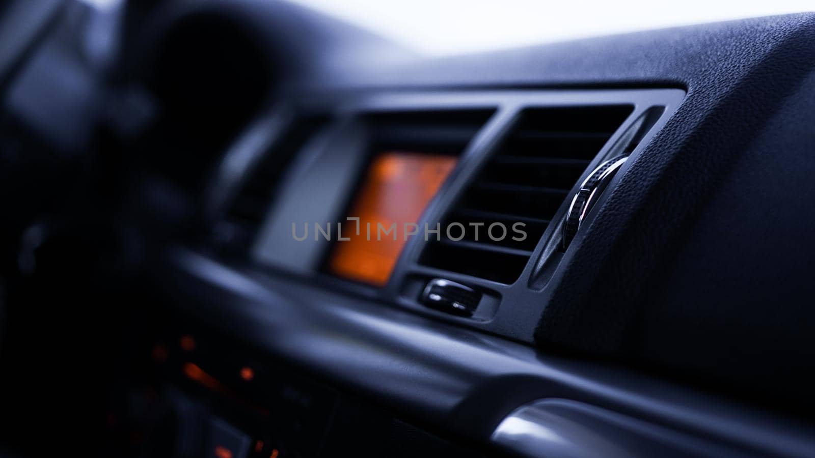 Buttons of radio, dashboard, climate control in car close up by natali_brill