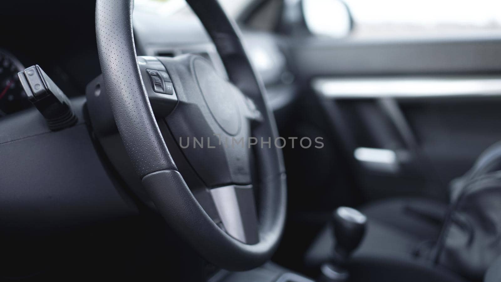 Interior view of car with black salon. Steering Wheel by natali_brill