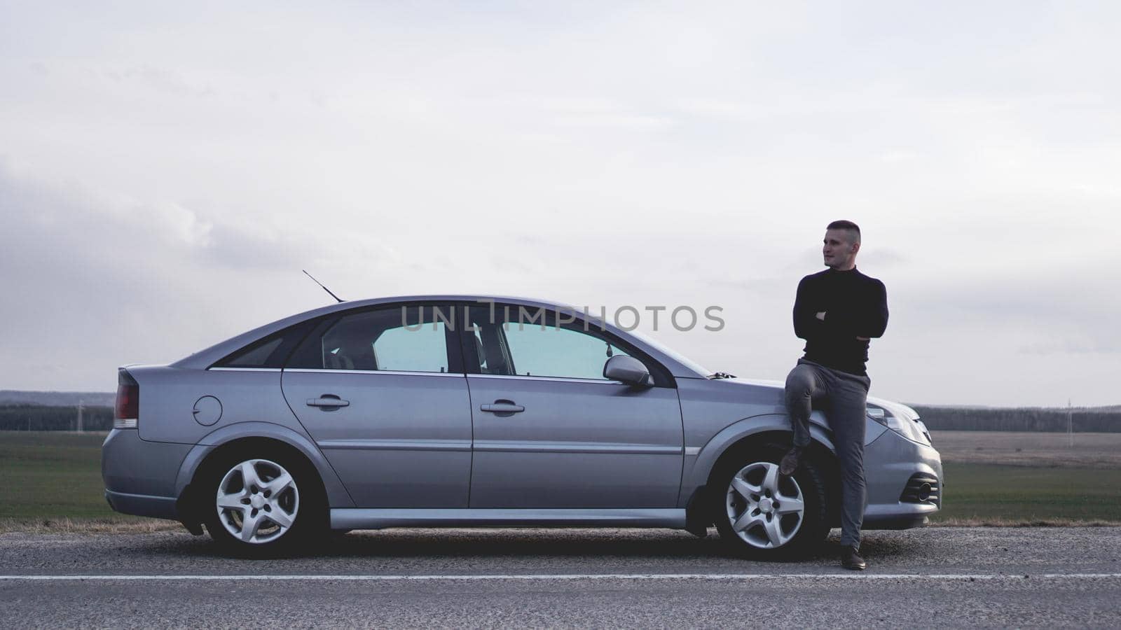 Handsome young man near the car. Luxury life.