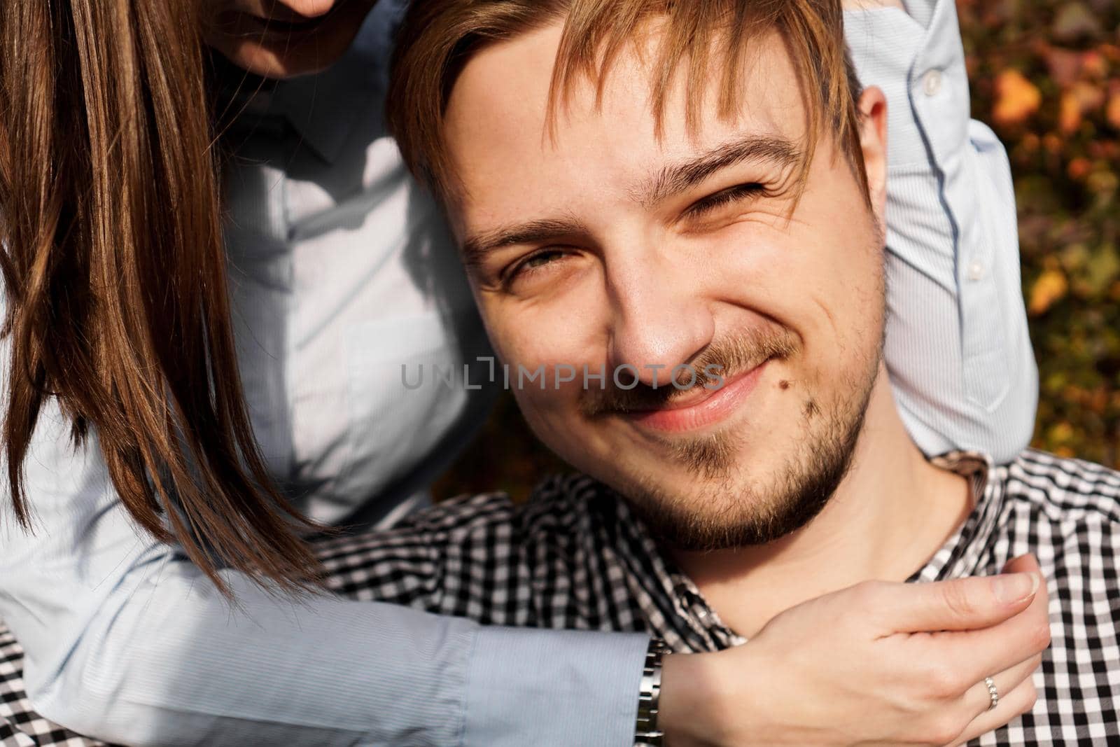 Cute couple having fun in autumn park . Love concept