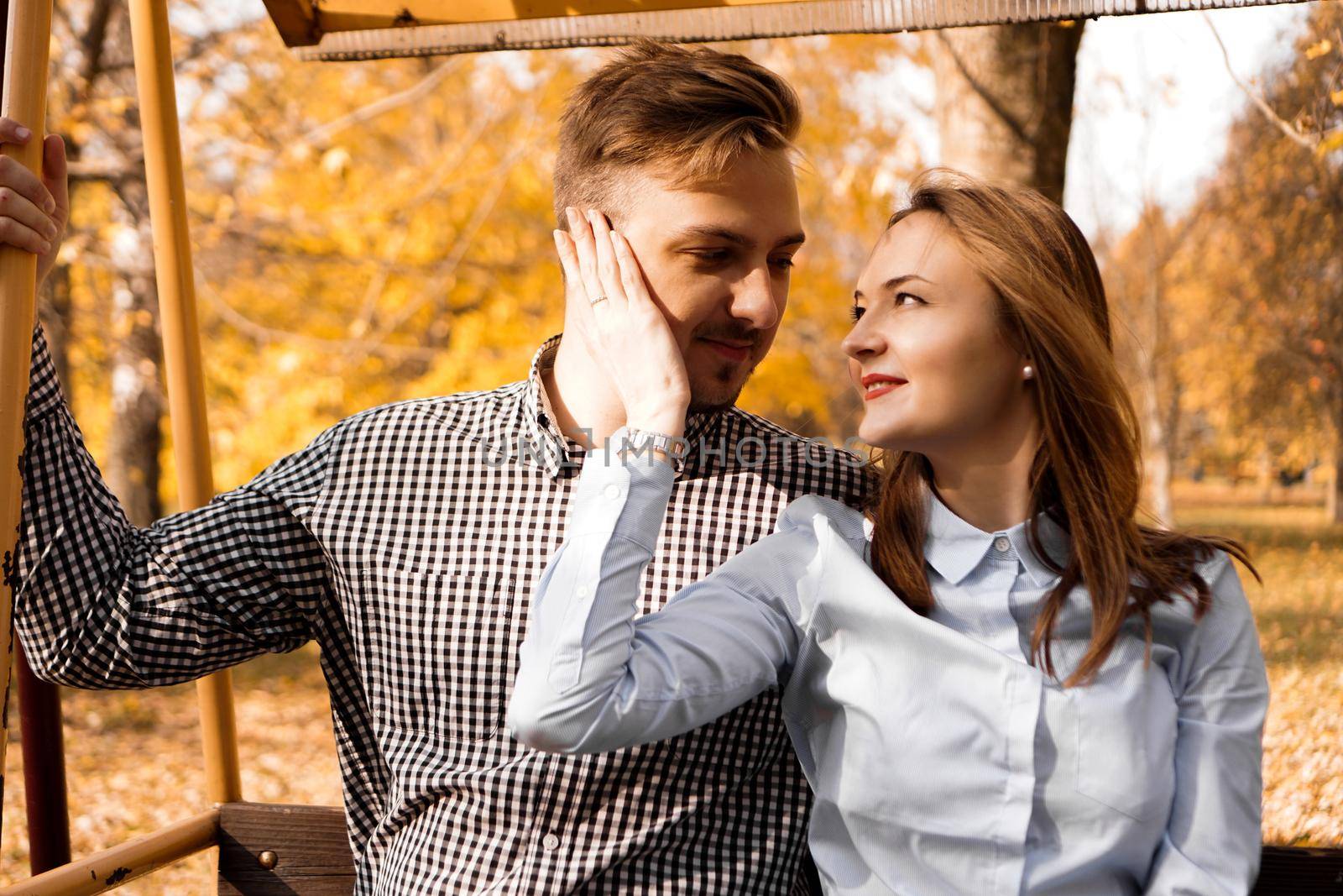 Romantic couple in the autumn park - love, relationship and dating concept by natali_brill
